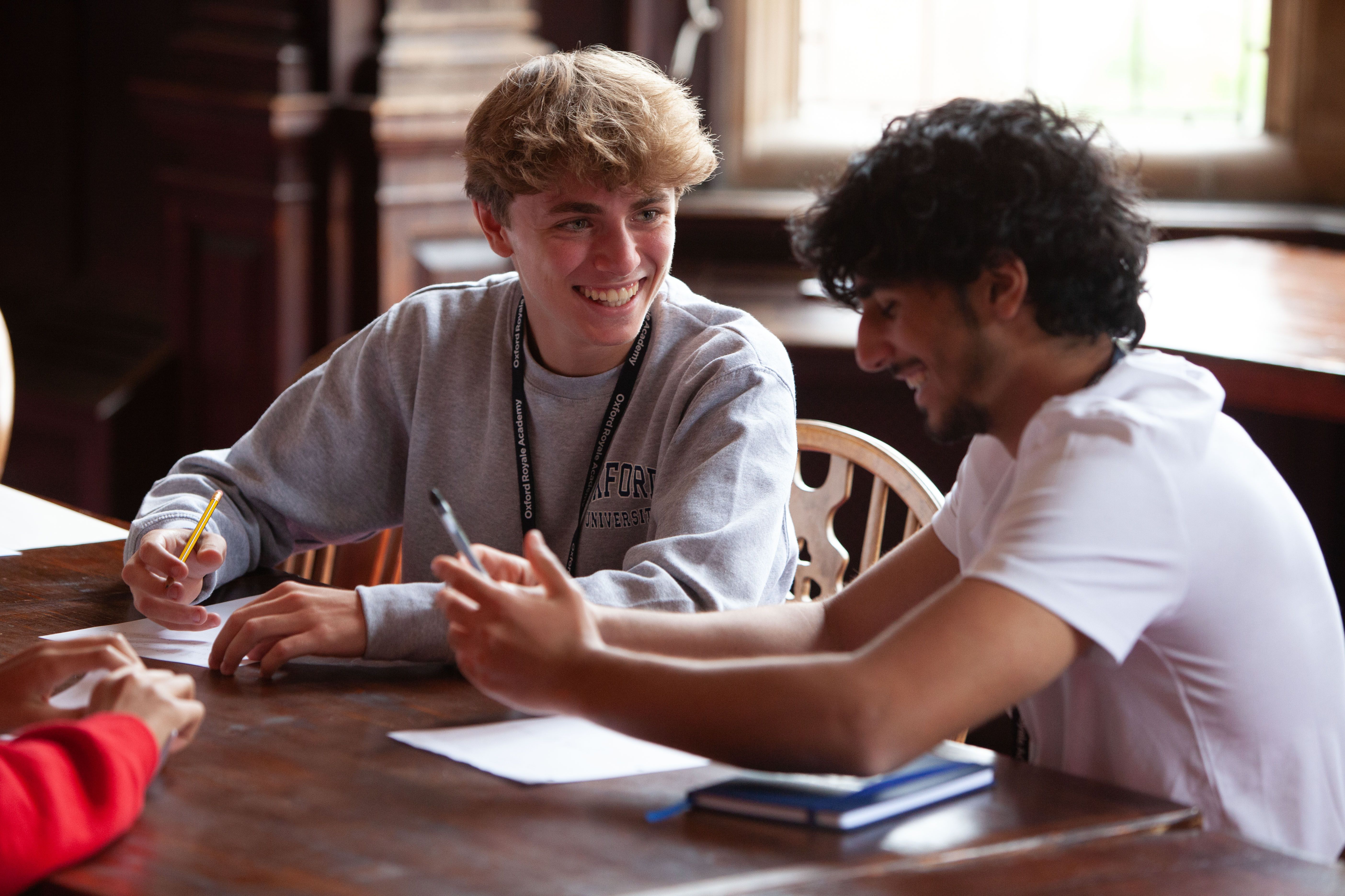 Oxford Royale students reviewing business plans in Cambridge