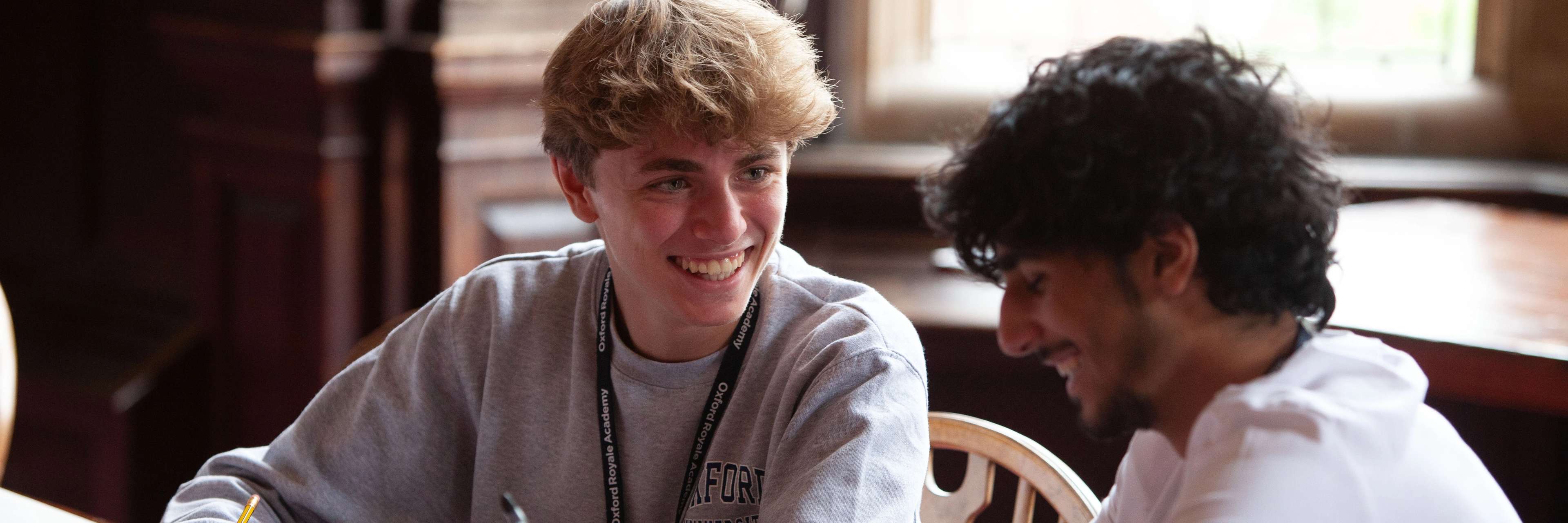 Oxford Royale students engaging in a class in a library