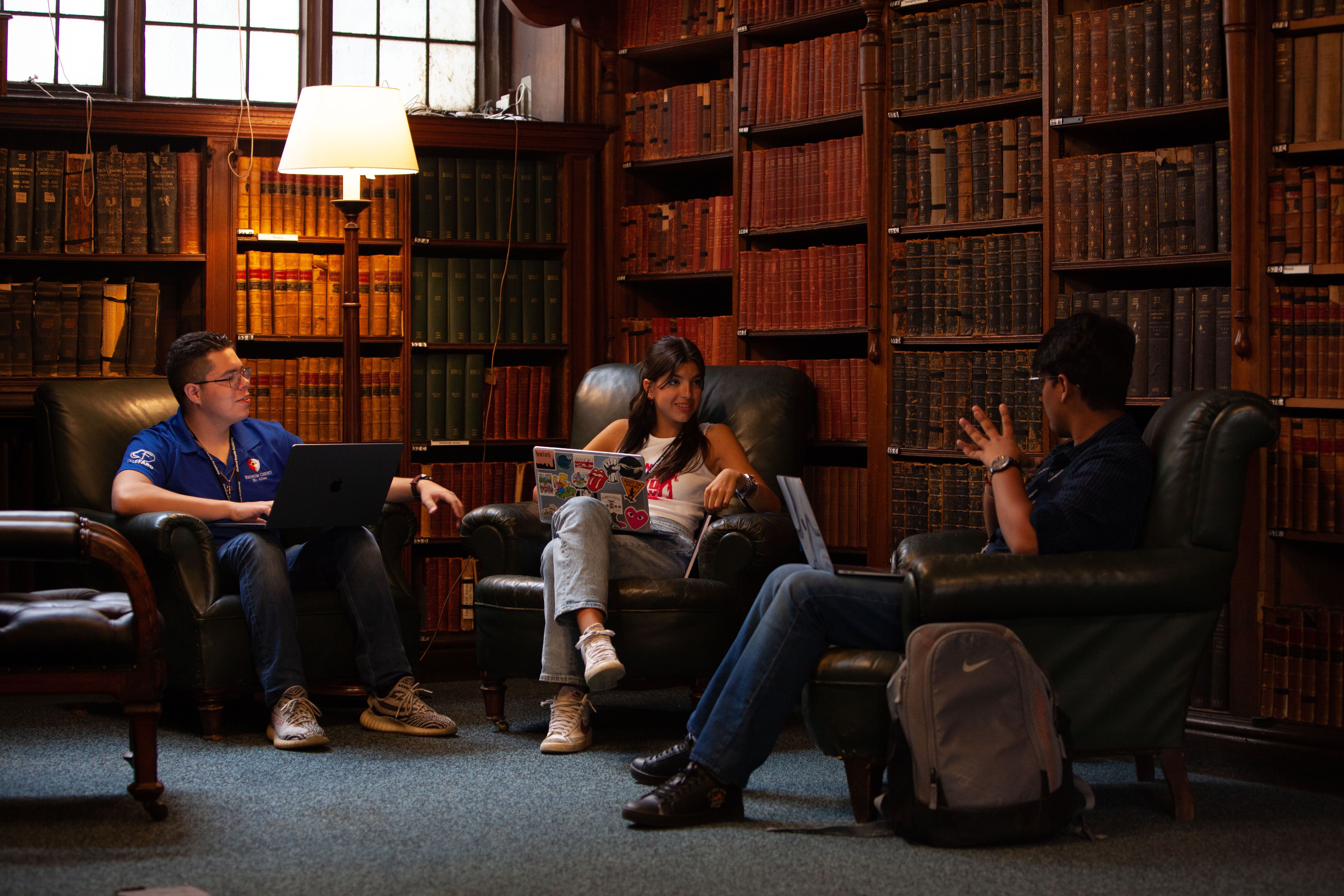 Oxford Royale students engaging in a class in a library