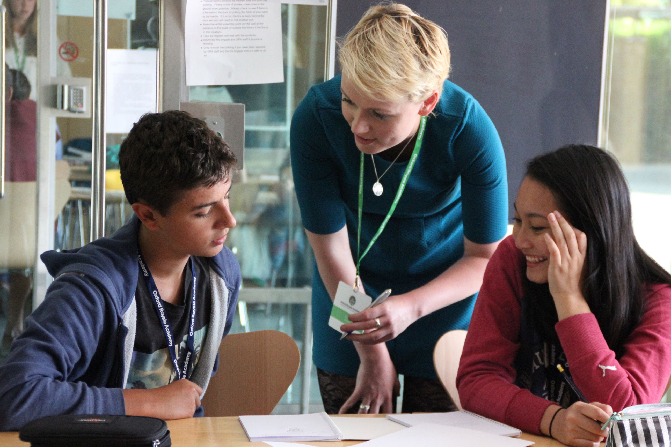 Teacher speaking with students