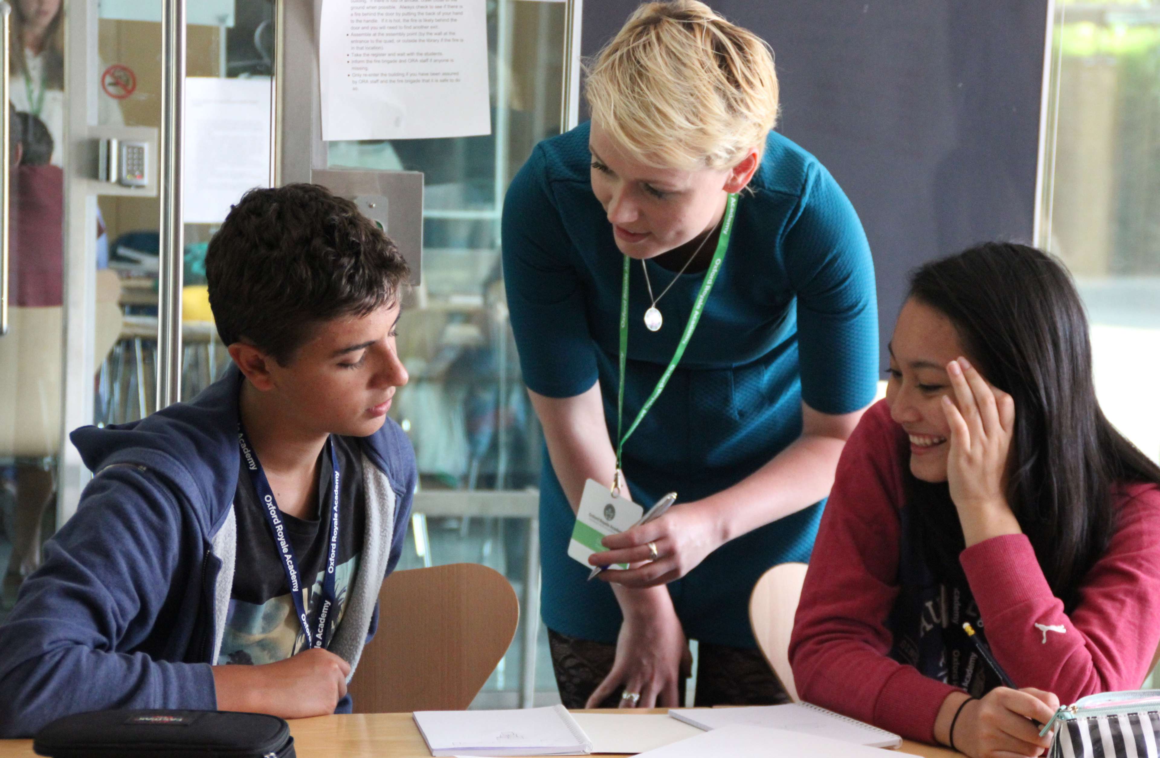 Teacher speaking with students