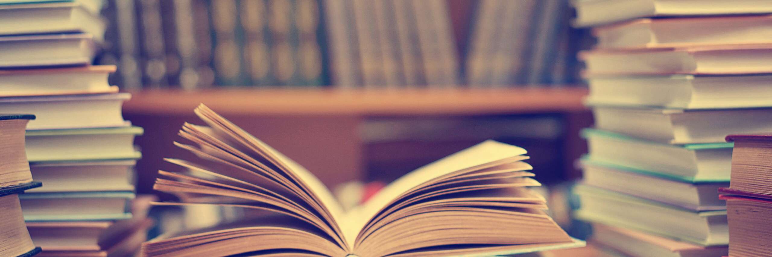 Books open on a desk