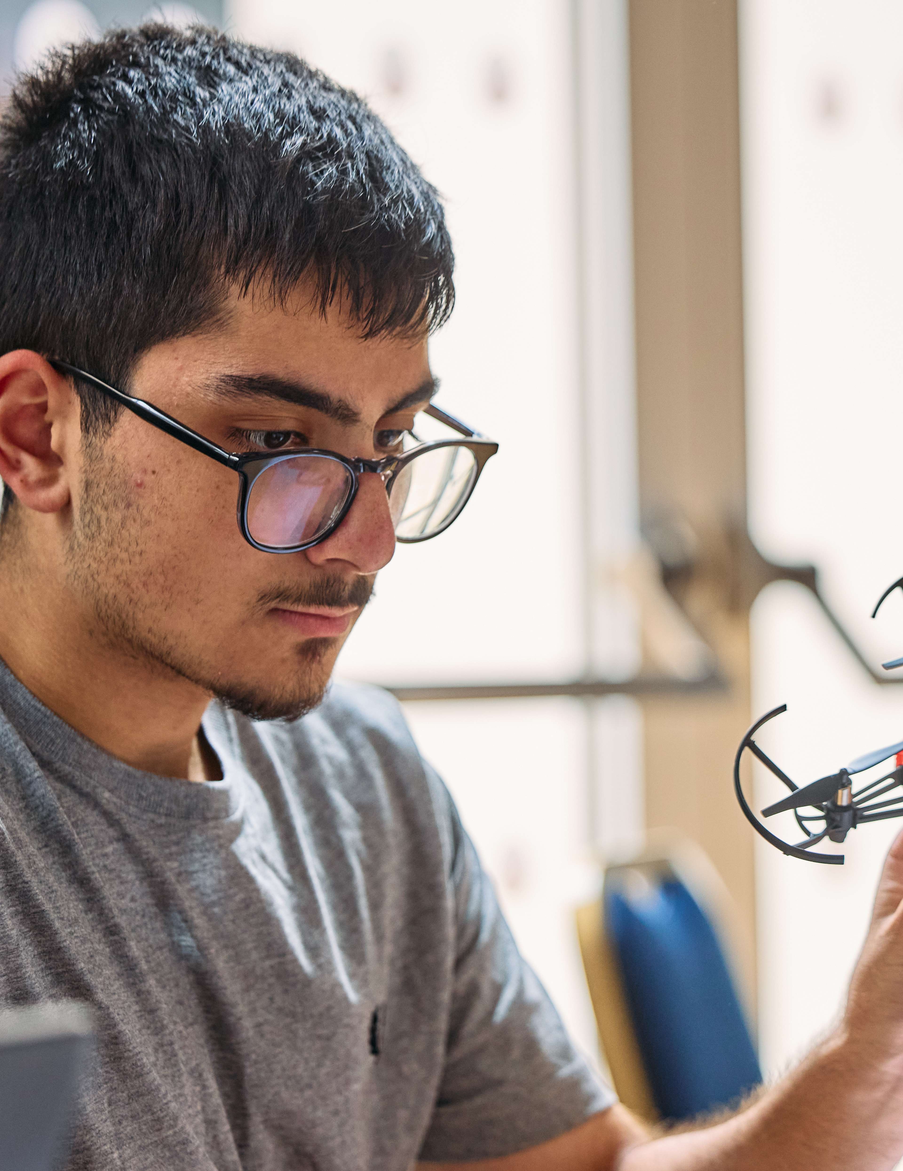 Oxford Royale Student holding a drone
