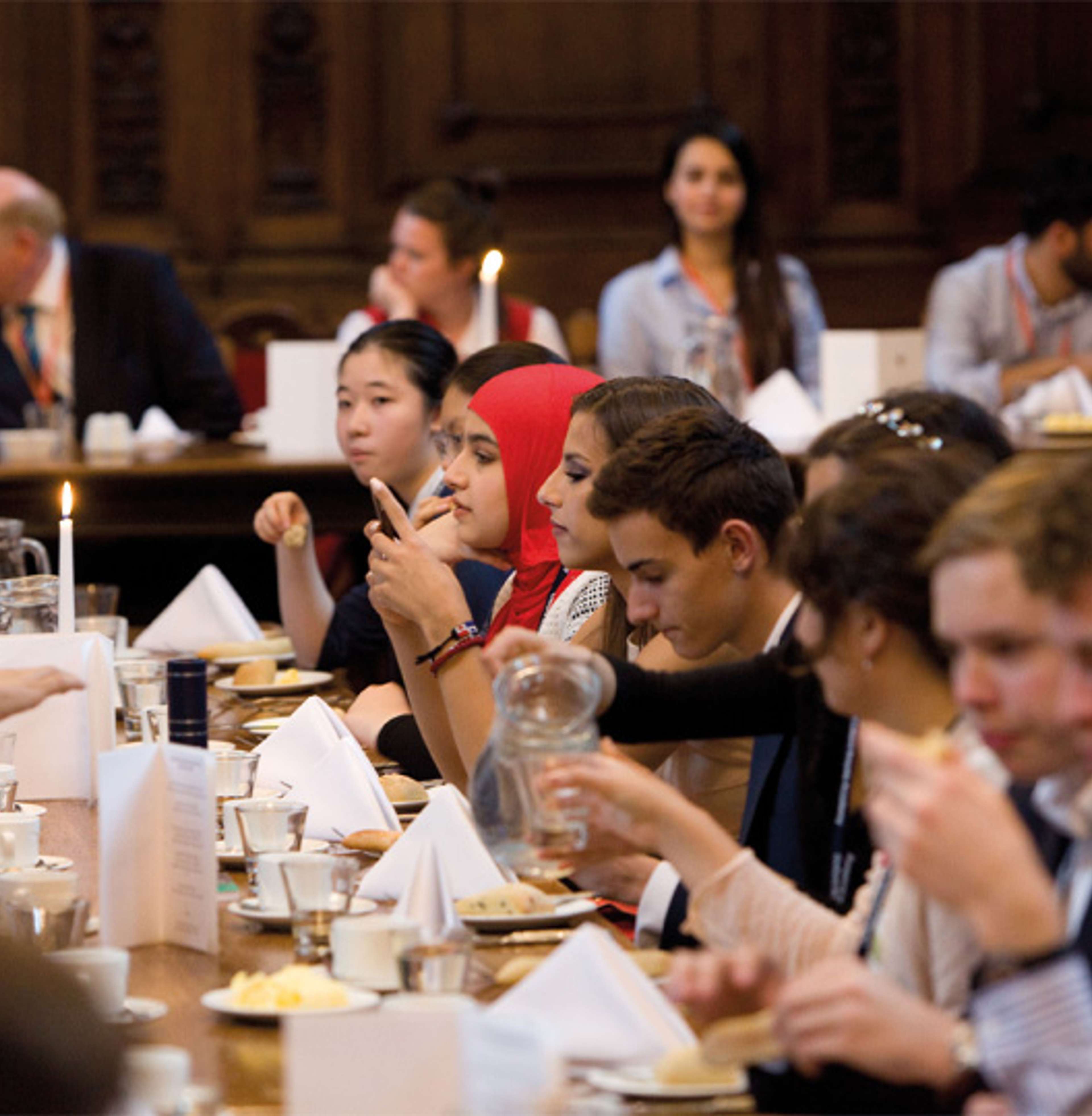 Oxford royale students in a Cambridge dining hall