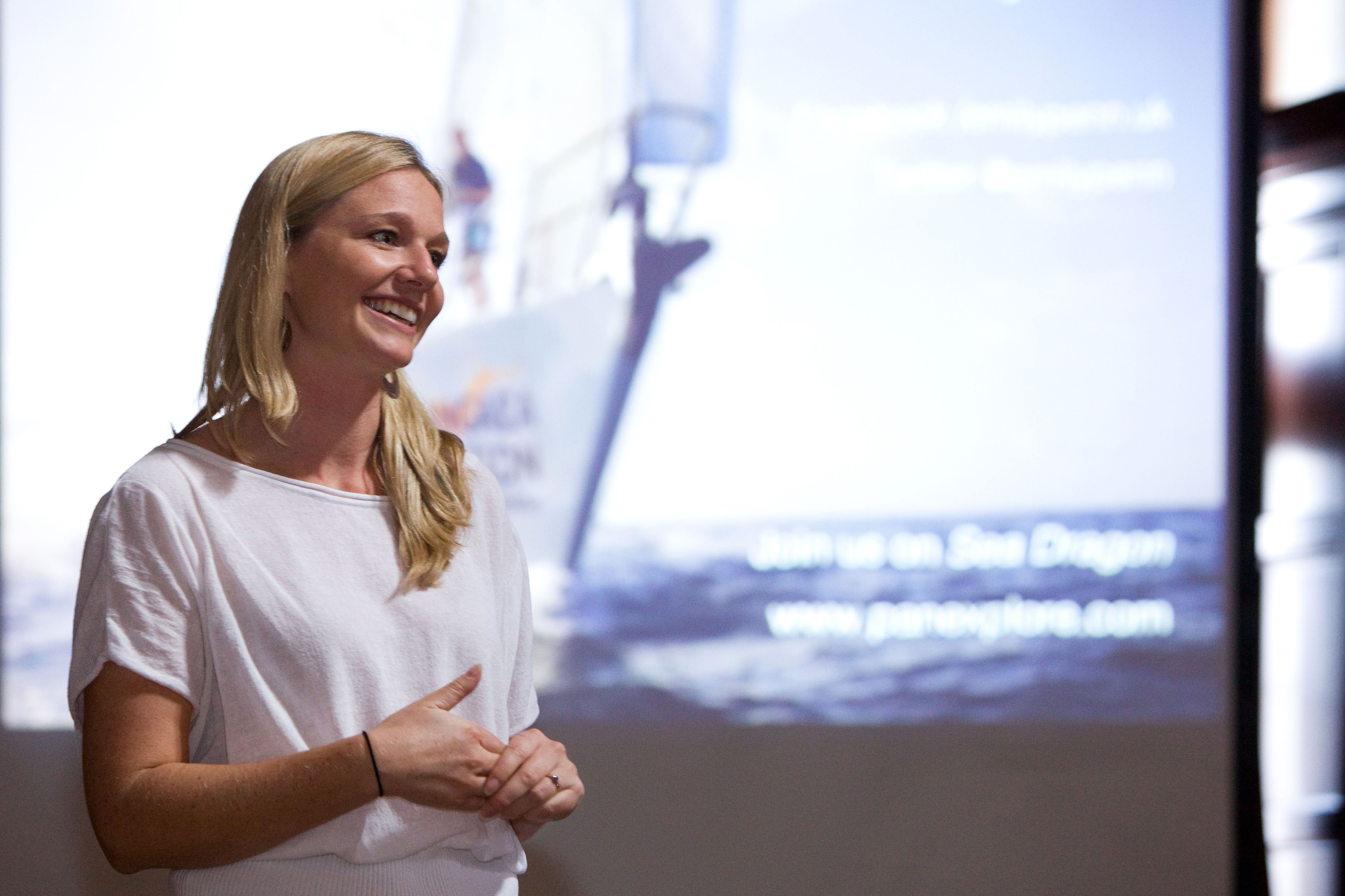 Woman speaking on stage