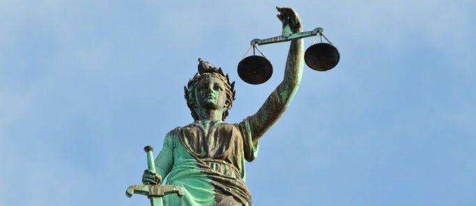 Two male students listening in class