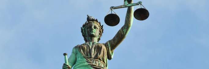 Two male students listening in class
