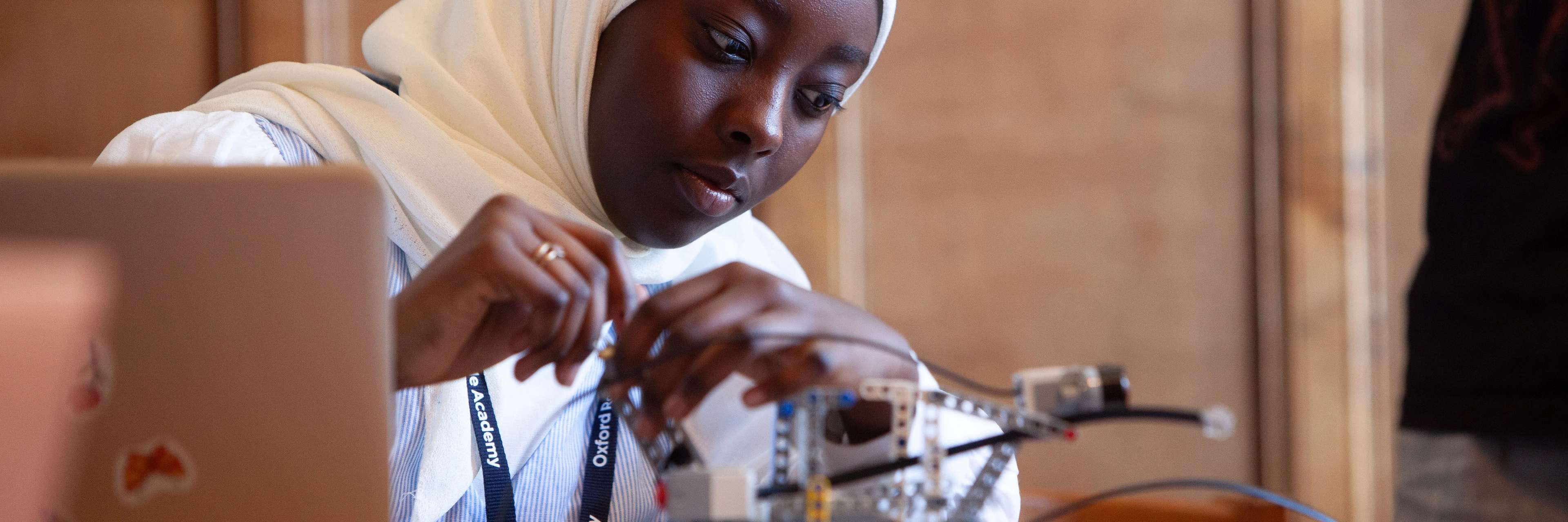 Oxford Royale students engaging ina robot building workshop