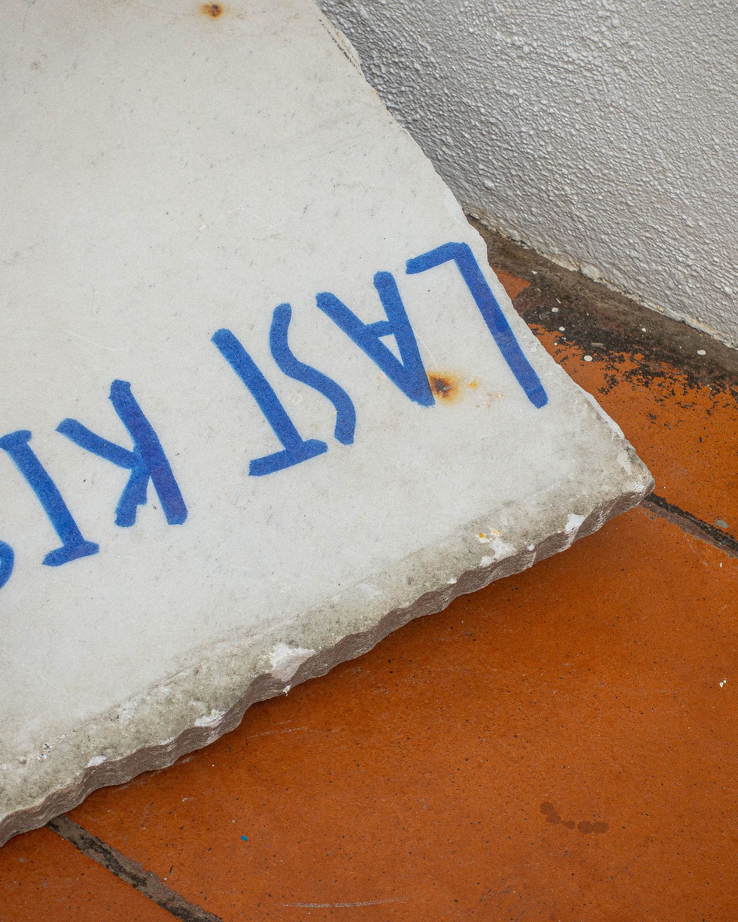 another writing in blue permanent marker