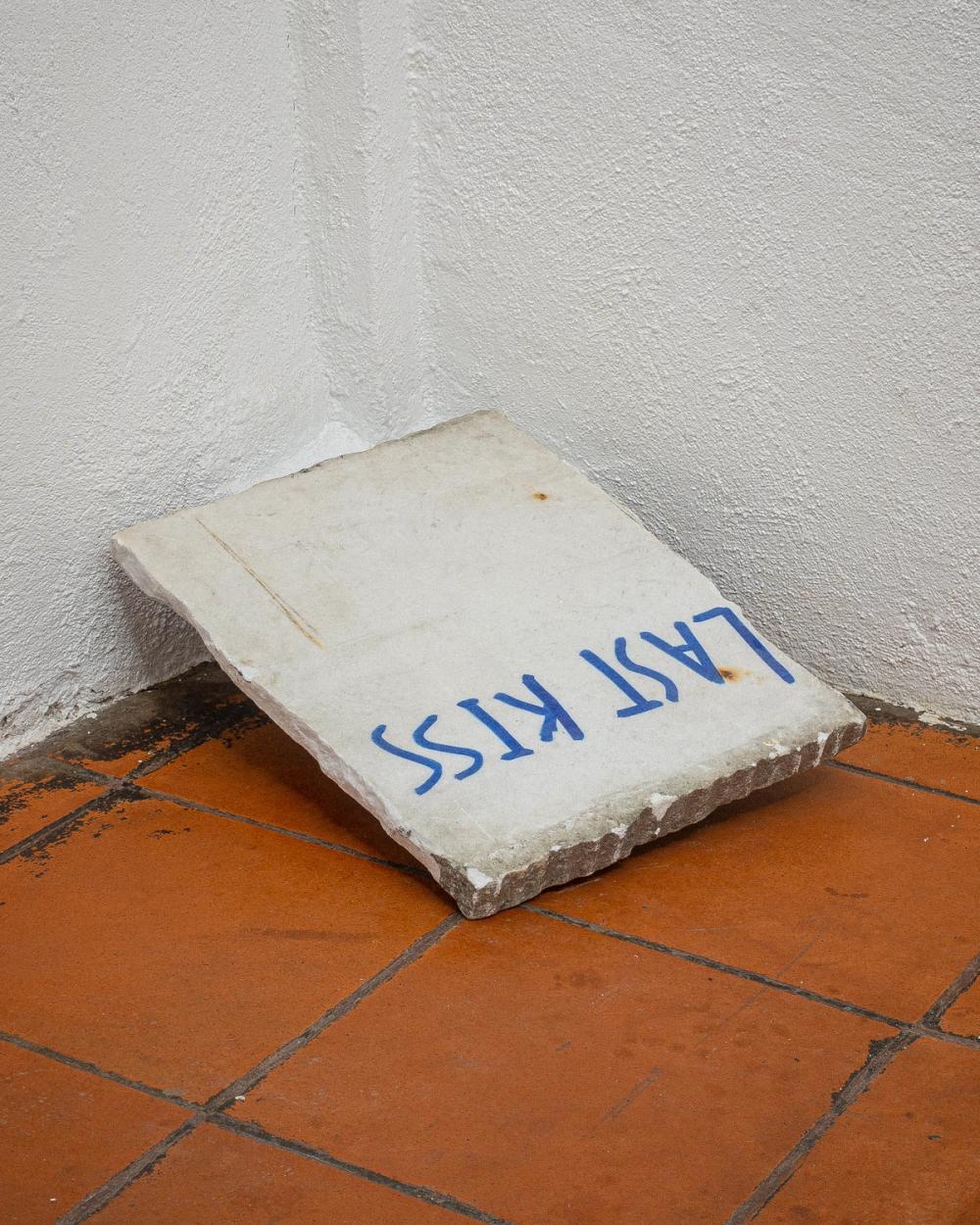 Artwork: another writing in blue permanent marker