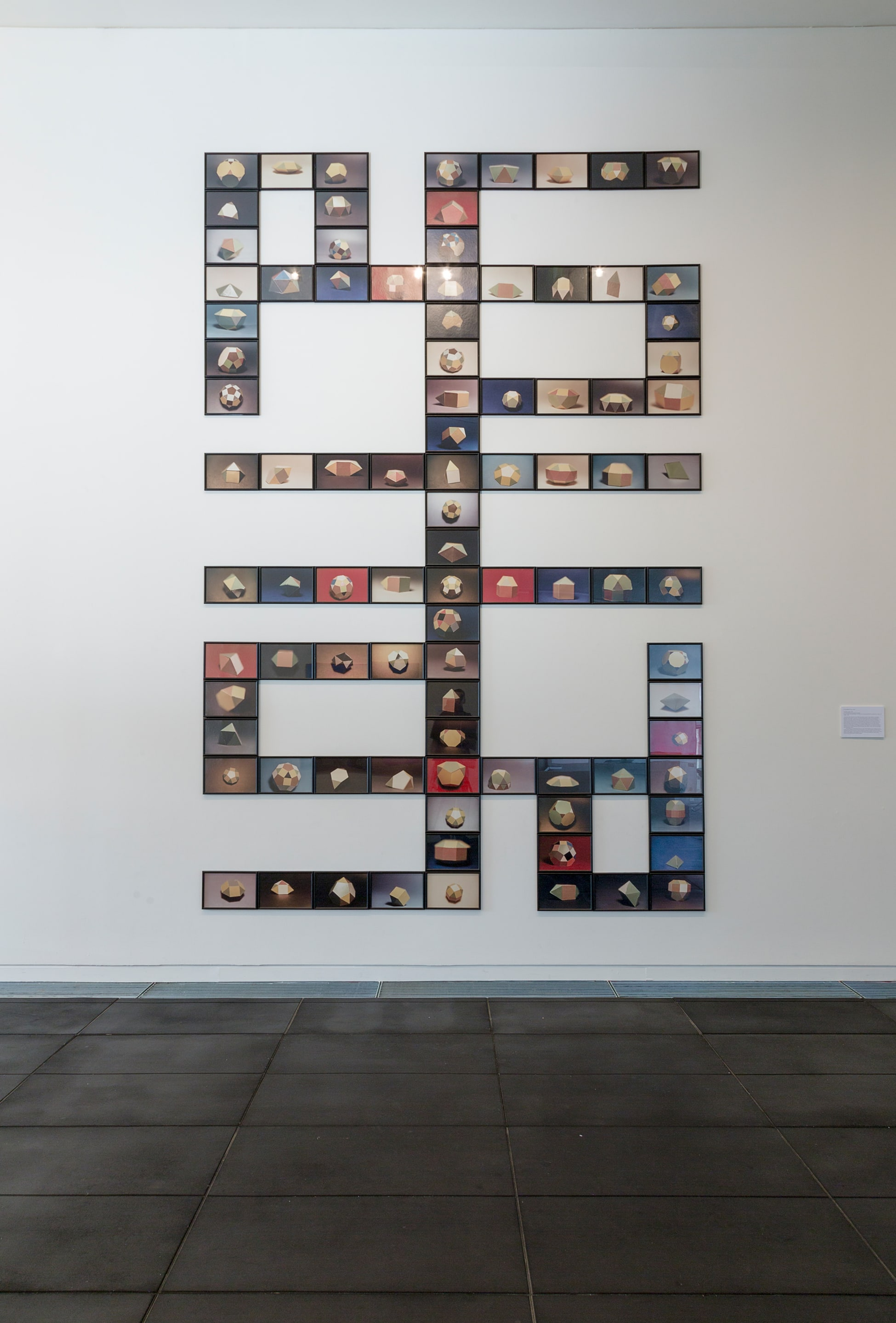 Gavin Hipkins, The Model (Action) , 1999, 92 individually framed colour photographs, Victoria University of Wellington Art Collection, commissioned for the opening of the Adam Art Gallery, installation view of the exhibition Then and Now, Here and Nowhere: Gavin Hipkins, Peter Trevelyan, Shaun Waugh, Kate Woods, and Brent Wong in The More You Know: The Victoria University Art Collection in Context at the Adam Art Gallery Te Pātaka Toi, Victoria University of Wellington (photo: Shaun Waugh)