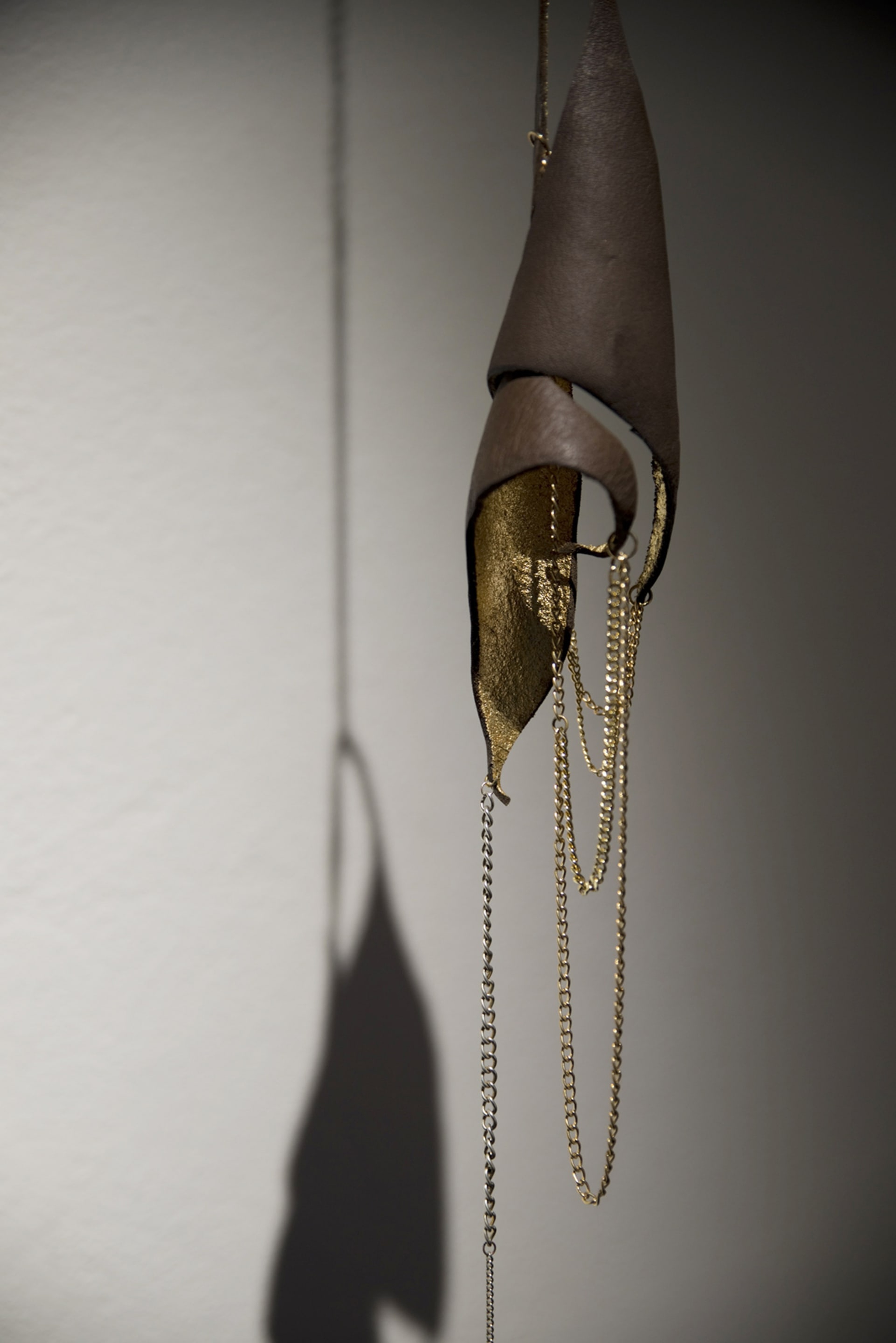 Signe Rose, Belladonna (detail), 2017, gold leaf, boiled leather, chain, crystal beads, jewellery findings. Courtesy of the artist, on view in Acting Out at Adam Art Gallery Te Pātaka Toi, photo: Shaun Matthews