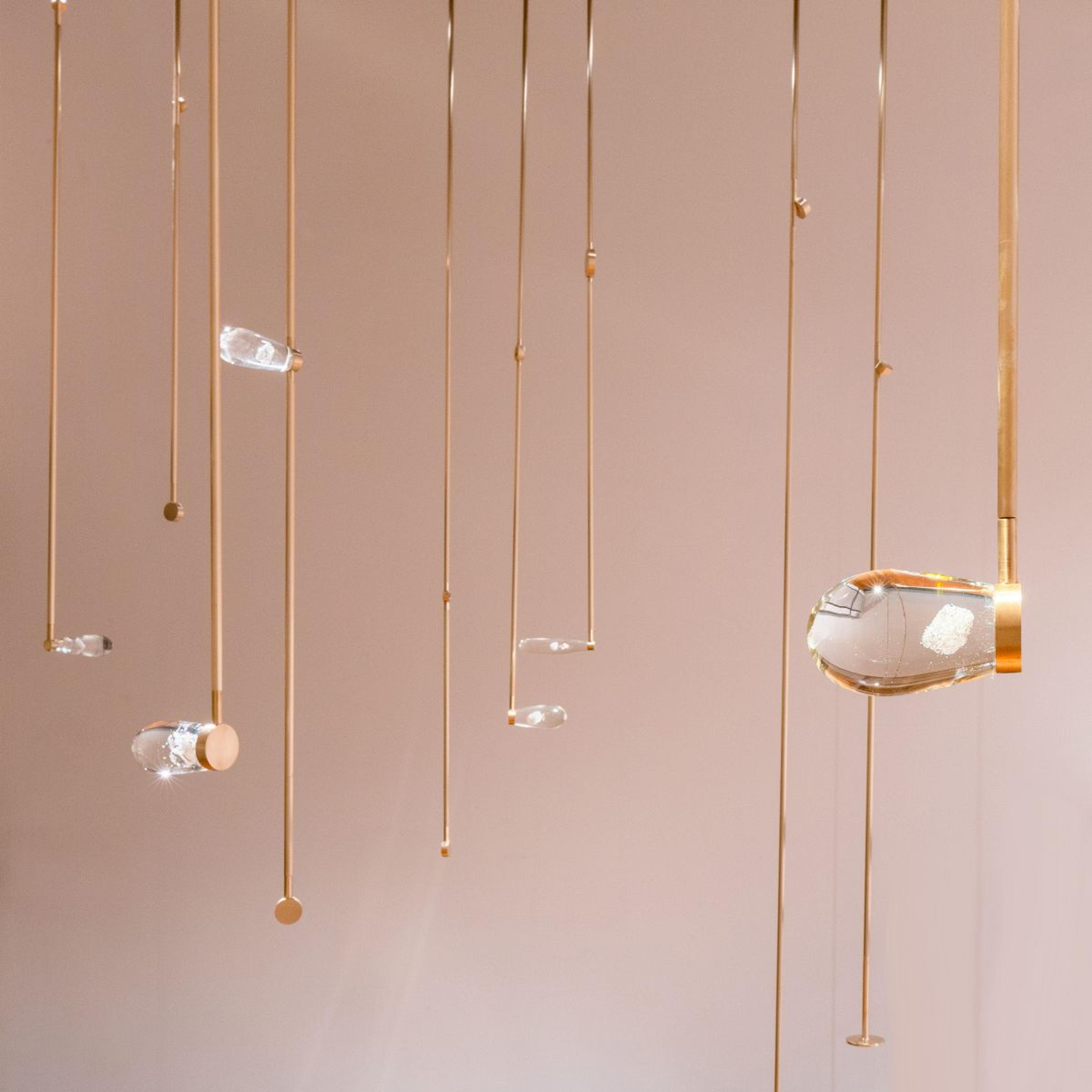 Sarah Smuts-Kennedy, detail of Harmonies, 2016, 13 brass rods, glass, Herkimer diamonds, dimensions variable, courtesy of the artist. Installation view Energy Work: Kathy Barry/ Sarah Smuts-Kennedy, Te Pātaka Toi Adam Art Gallery, Te Herenga Waka–Victoria University Wellington, 2022. Photo courtesy of Ted Whitaker