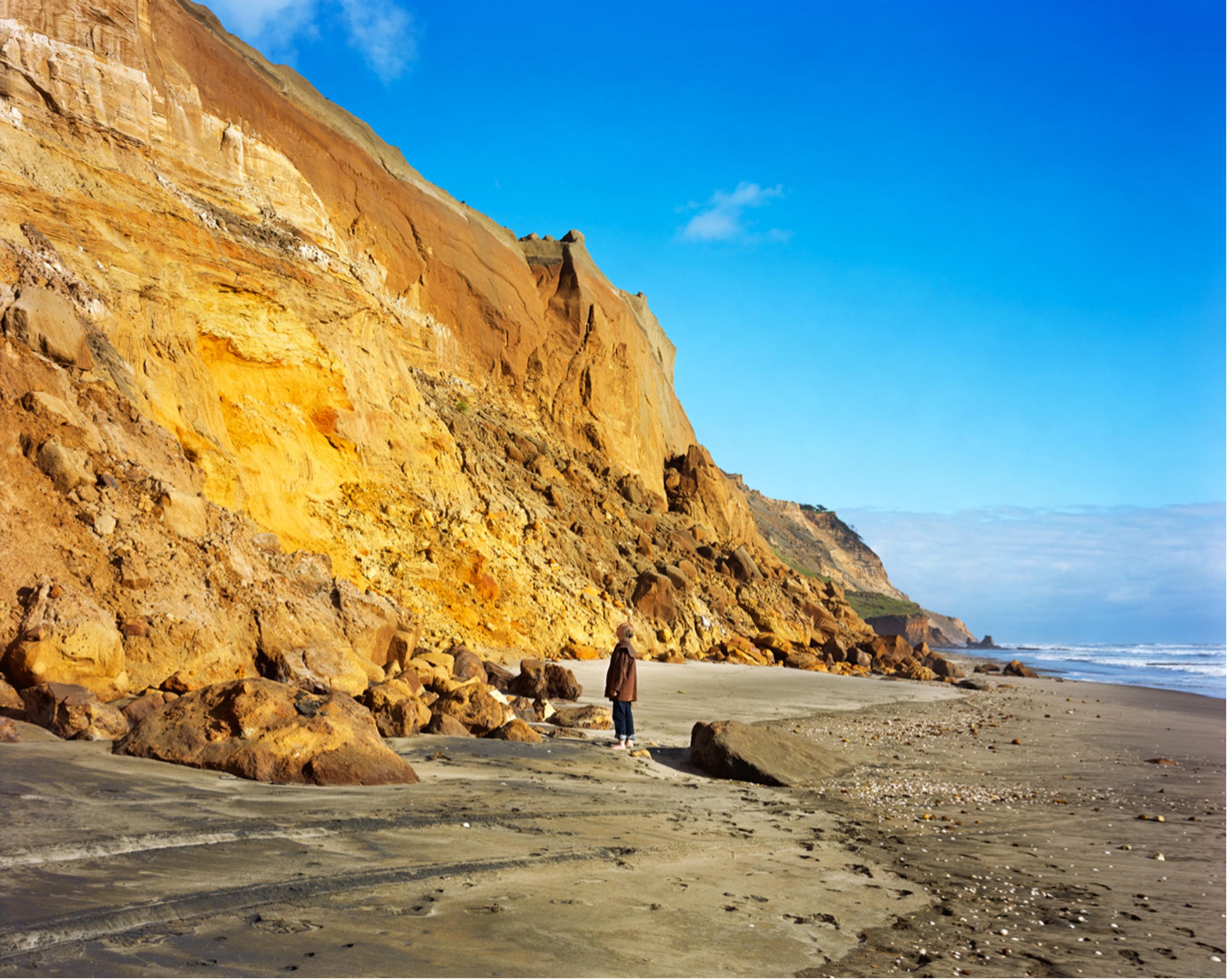 Chris Corson Scott, Mark Adams Before Cliffs and Rockfalls, Awhitu Peninsula, 2015, archival pigment print, 1100 × 1350 mm. Courtesy of the artist and Trish Clark Gallery, Auckland