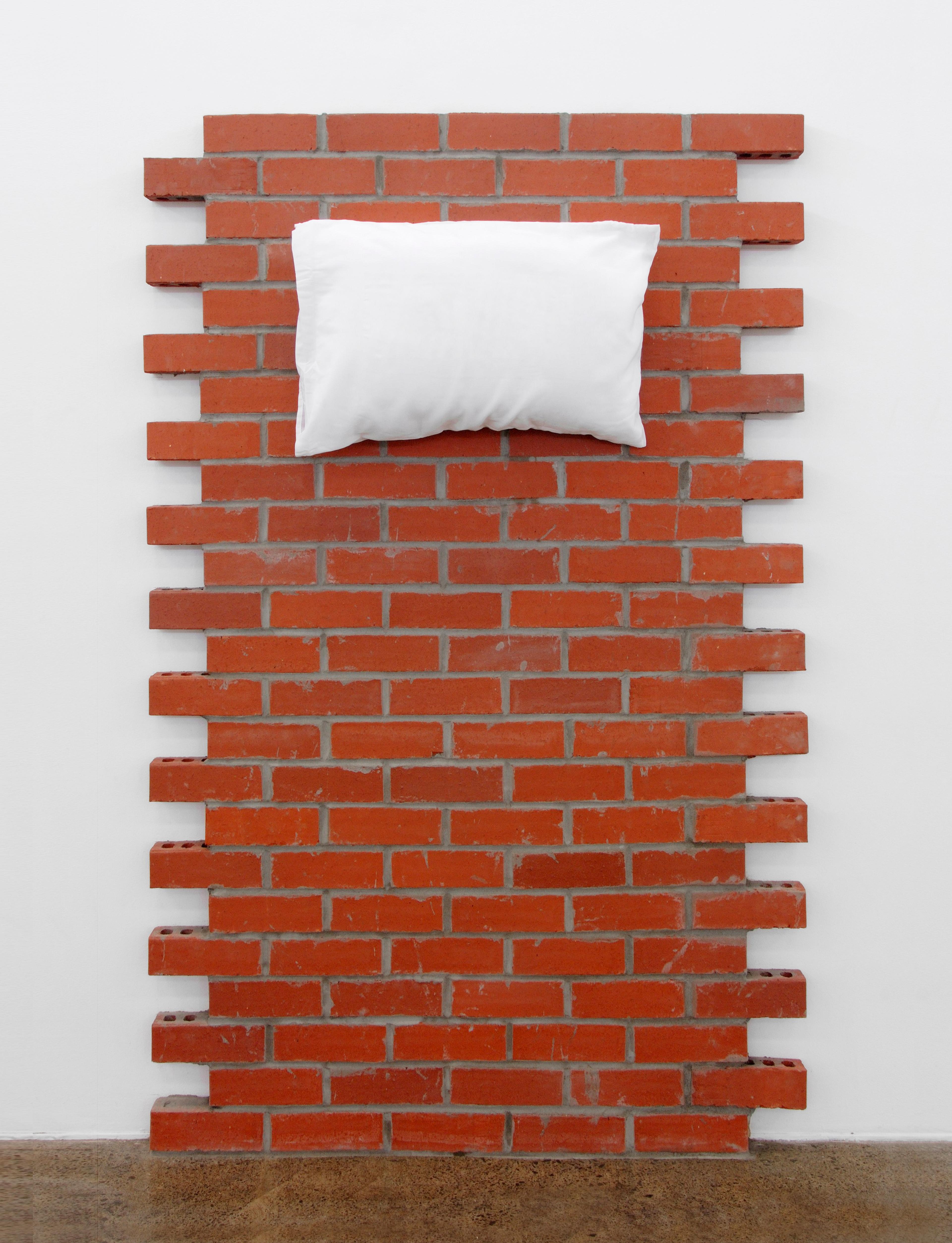 Brick wall with pillow