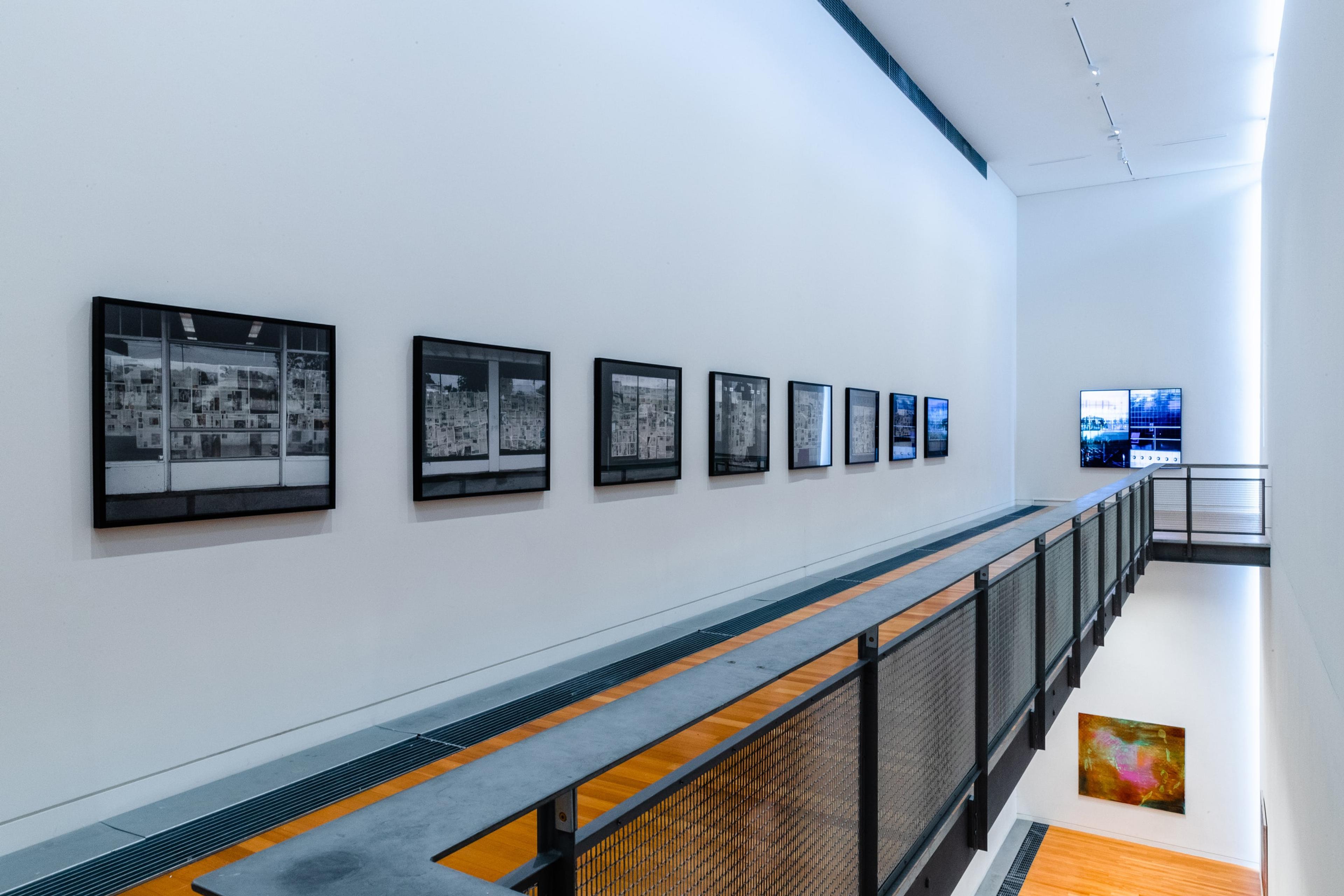 Wide shot of upper and lower chartwell gallery with square images on the walls
