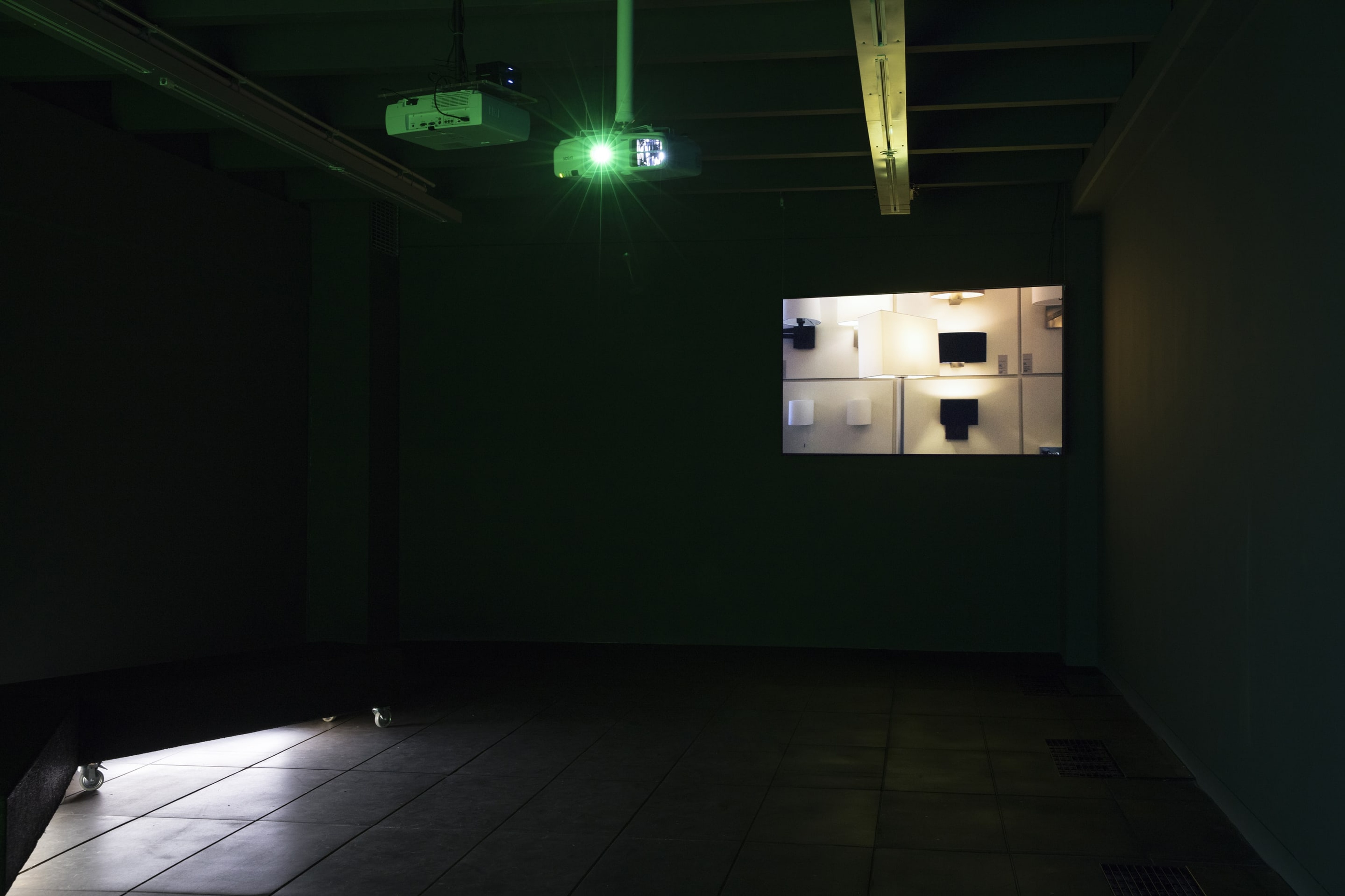 Installation view of Juliet Carpenter & Evangeline Riddiford Graham, Luma Turf, 2013, HD video, 7 mins, 27 secs, courtesy of the artists. In the exhibition Inhabiting Space at the Adam Art Gallery Te Pātaka Toi, Victoria University of Wellington (photo: Shaun Waugh)