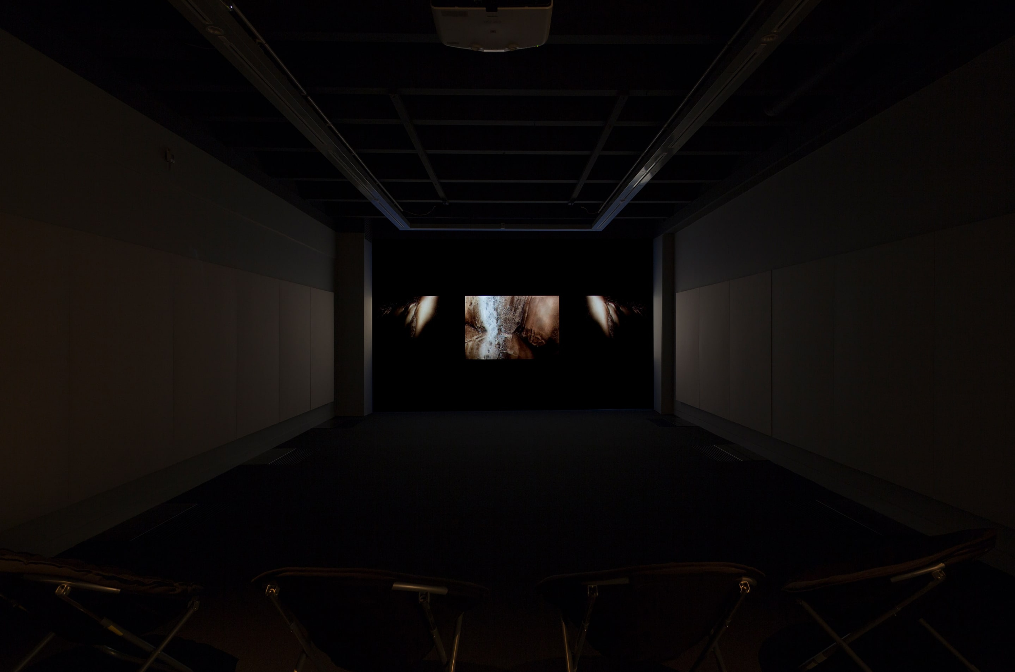 Phil Solomon, installation view of American Falls, 2000-12. Digital video, altered archival footage, colour, 5.1 and stereo sound, 55mins. Commissioned by the Corcoran Gallery of Art, Washington, D.C. Courtesy of the artist. Photo: Shaun Waugh.