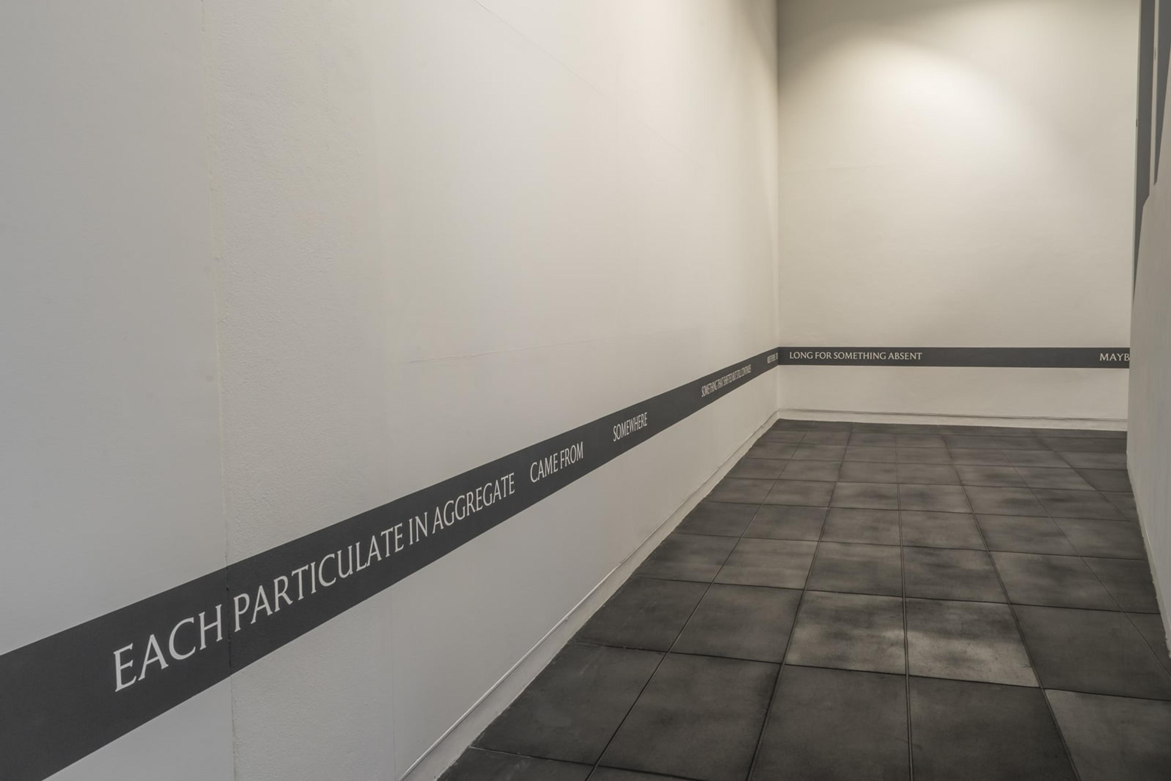 Ana Iti, Does the brick recall Pukeahu?, 2017, text, acrylic, dimensions variable, courtesy of the artist. Installation view, The earth looks upon us / Ko Papatūānuku te matua o te tangata, curated by Christina Barton, Adam Art Gallery Te Pātaka Toi, Victoria University of Wellington