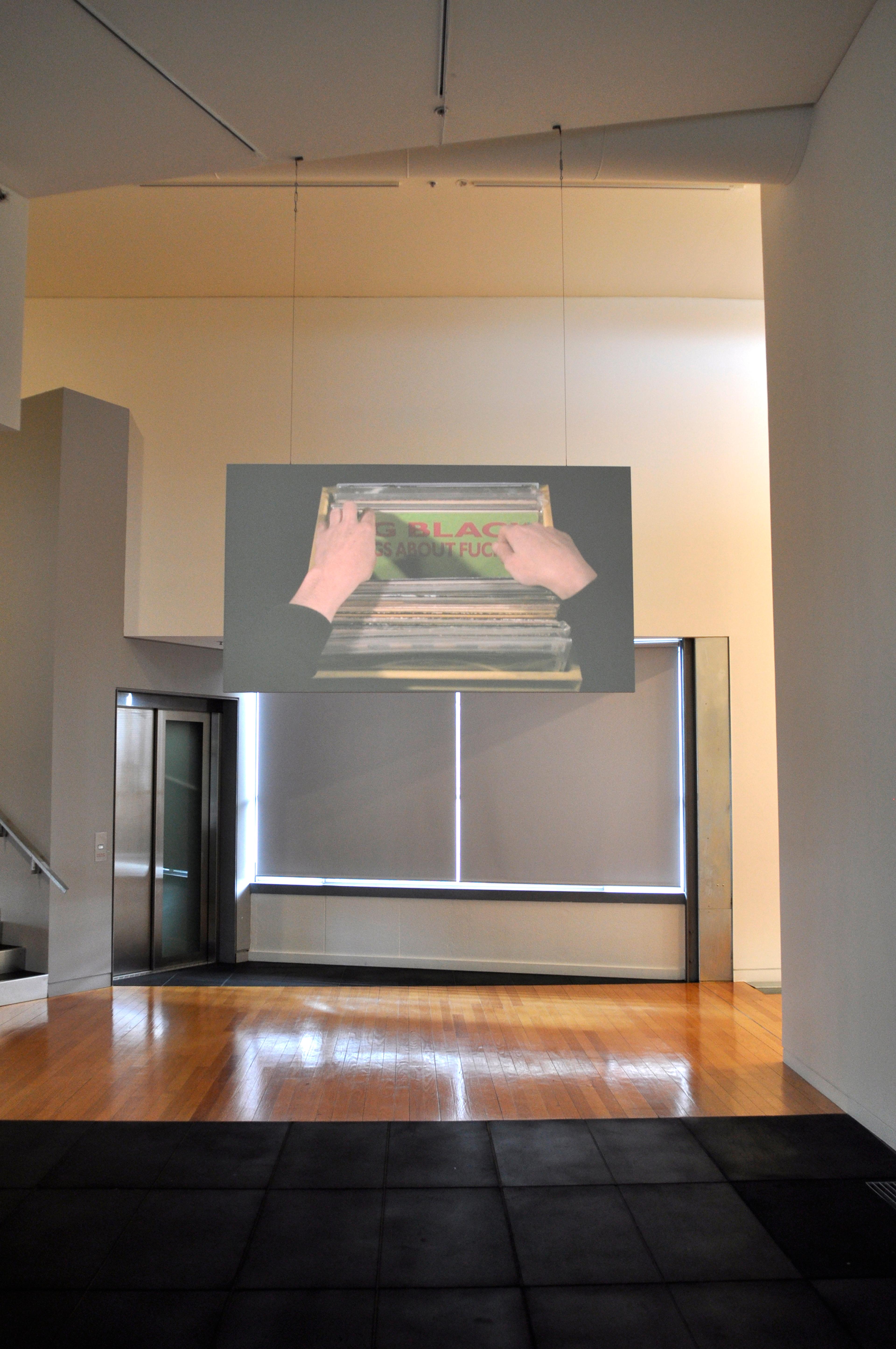 Caroline Johnston, Songs about “PLEASE REMOVE”, 2010. DVD with sound (8' 39" repeated). Installation view, Object Lessons: A Musical Fiction, Adam Art Gallery Te Pātaka Toi, Victoria University of Wellington. Photo: Michael Salmon