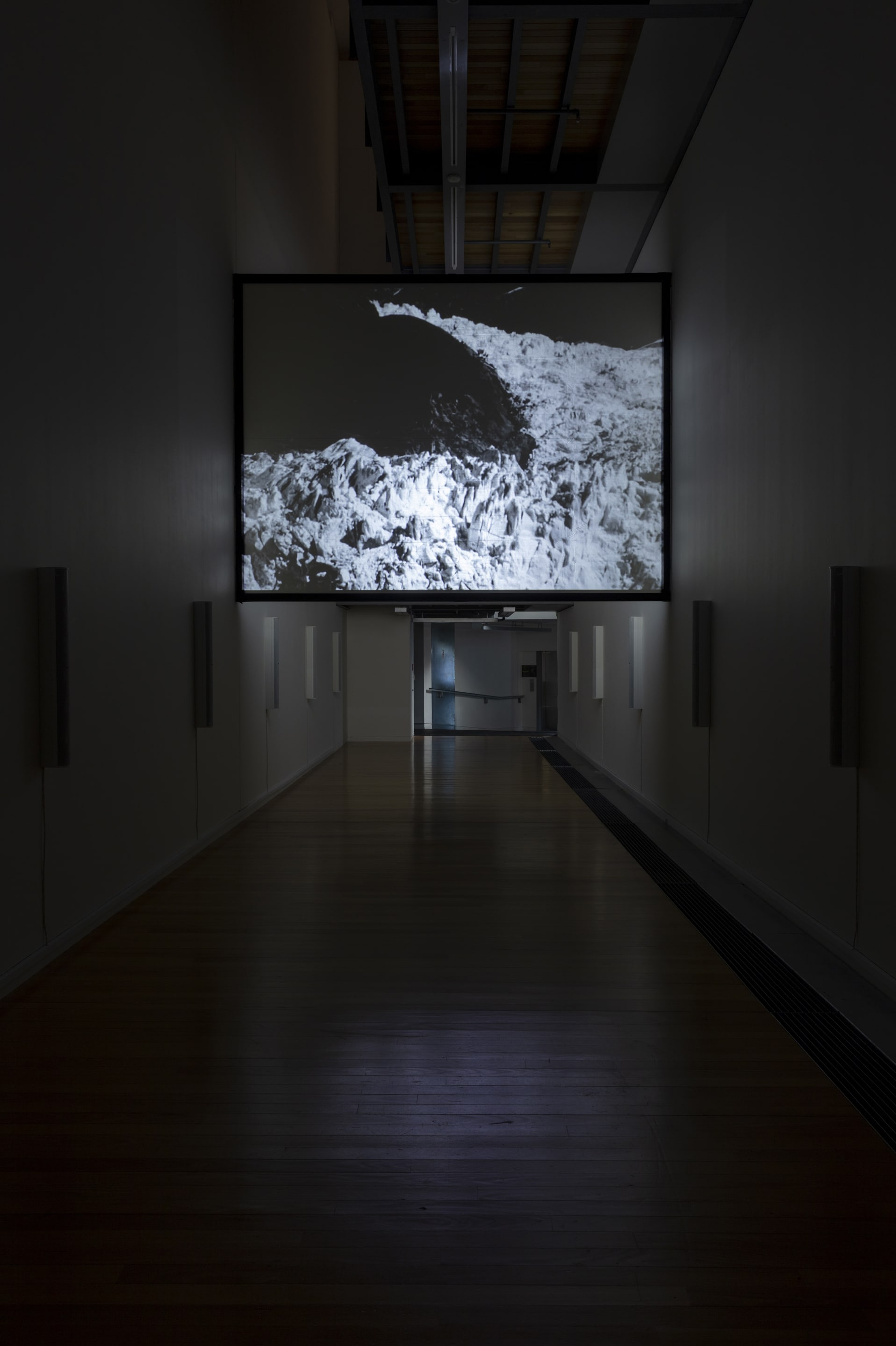 Susan Philipsz, White Flood, 2019, 12-channel sound installation and HD film, 15 minutes. Courtesy of the artist, Tanya Bonakdar Gallery, New York and Galerie Isabella Bortolozzi, Berlin. Installation view, Passages: Luke Fowler, Florian Hecker, Susan Philipsz, curated by Stephen Cleland, Adam Art Gallery Te Pātaka Toi, Victoria University of Wellington, 2019. Photo: Shaun Waugh.