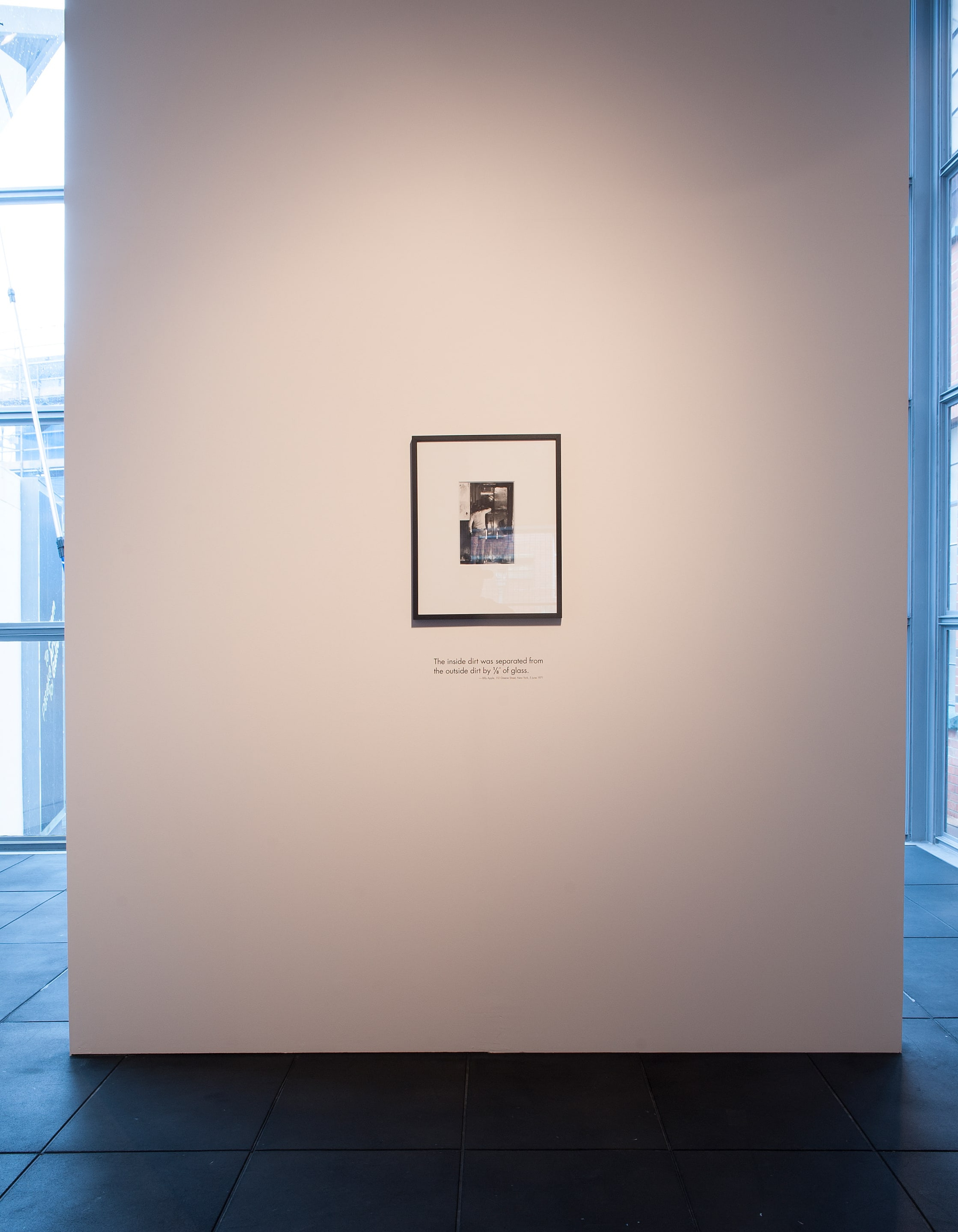 Installation view of Billy Apple, Window Cleaning, 5 June 1971 (1971). Black and white photograph and text. Victoria University of Wellington Art Collection, gift of the artist 2009. Photo: Robert Cross.