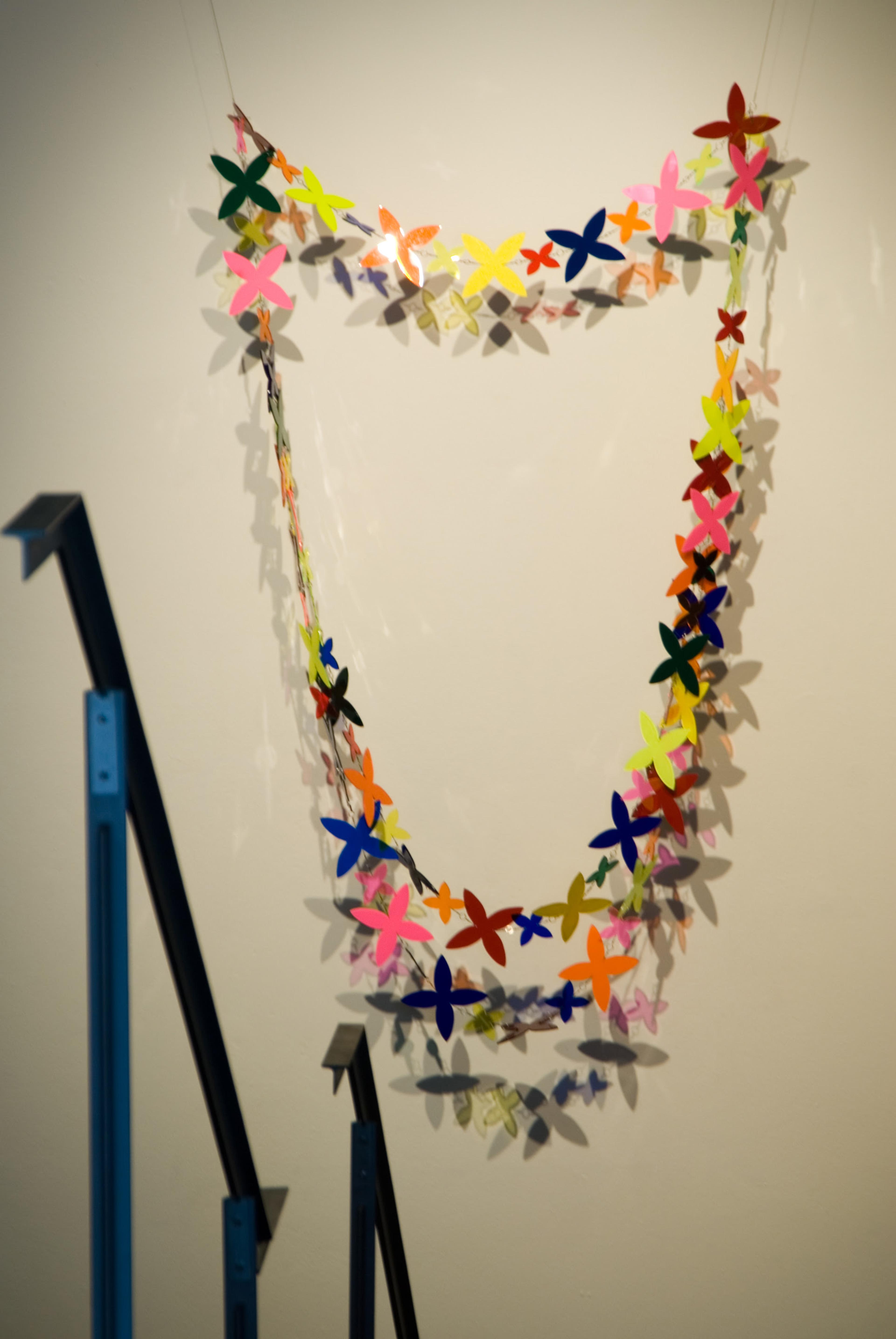 Niki Hastings-McFall, A Flock of Blooms, 2001, vinyl and perspex with metal fishing links, 2400 x 1300mm. Installation view, In View: Works From the VUW Art Collection, Adam Art Gallery Te Pātaka Toi, Victoria University of Wellington, 2006