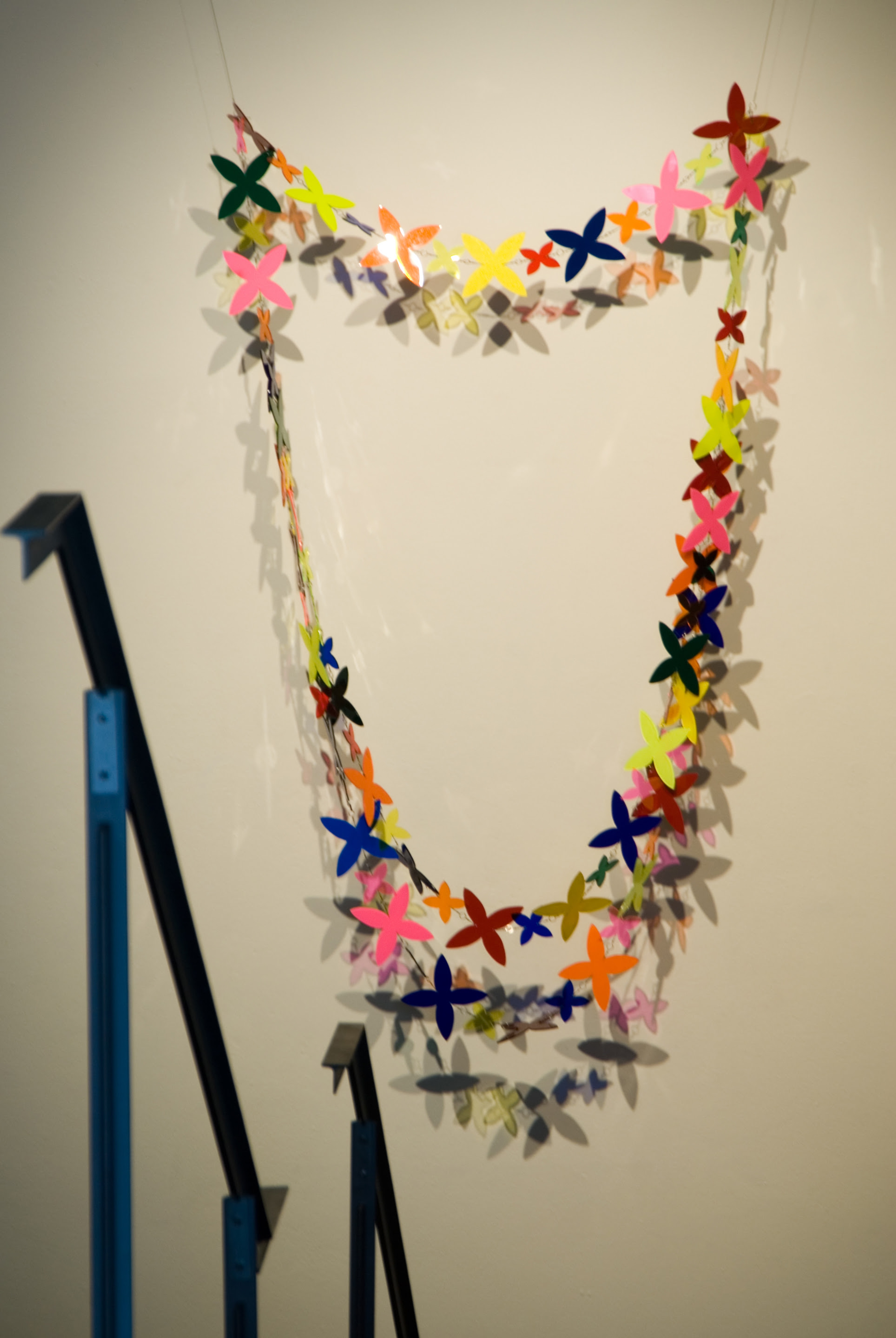 Niki Hastings-McFall, A Flock of Blooms, 2001, vinyl and perspex with metal fishing links, 2400 x 1300mm. Installation view, In View: Works From the VUW Art Collection, Adam Art Gallery Te Pātaka Toi, Victoria University of Wellington, 2006