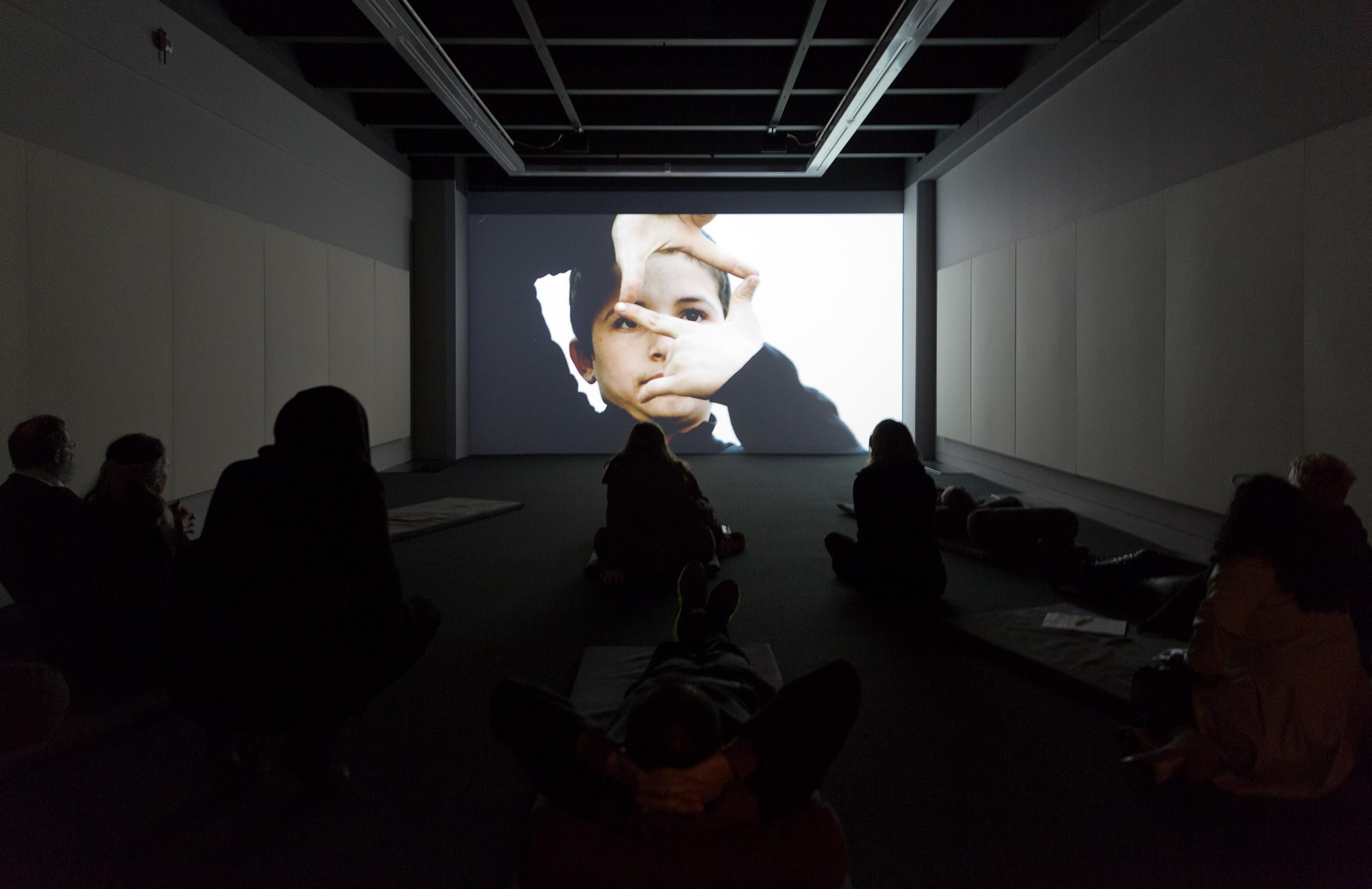 Installation view of Francis Alÿs (in collaboration with Julien Devaux and Ajmal Maiwandi), Reel-Unreel (2011) at the Adam Art Gallery. Single channel video projection, 19:28min, color, sound. Photo: Shaun Waugh.