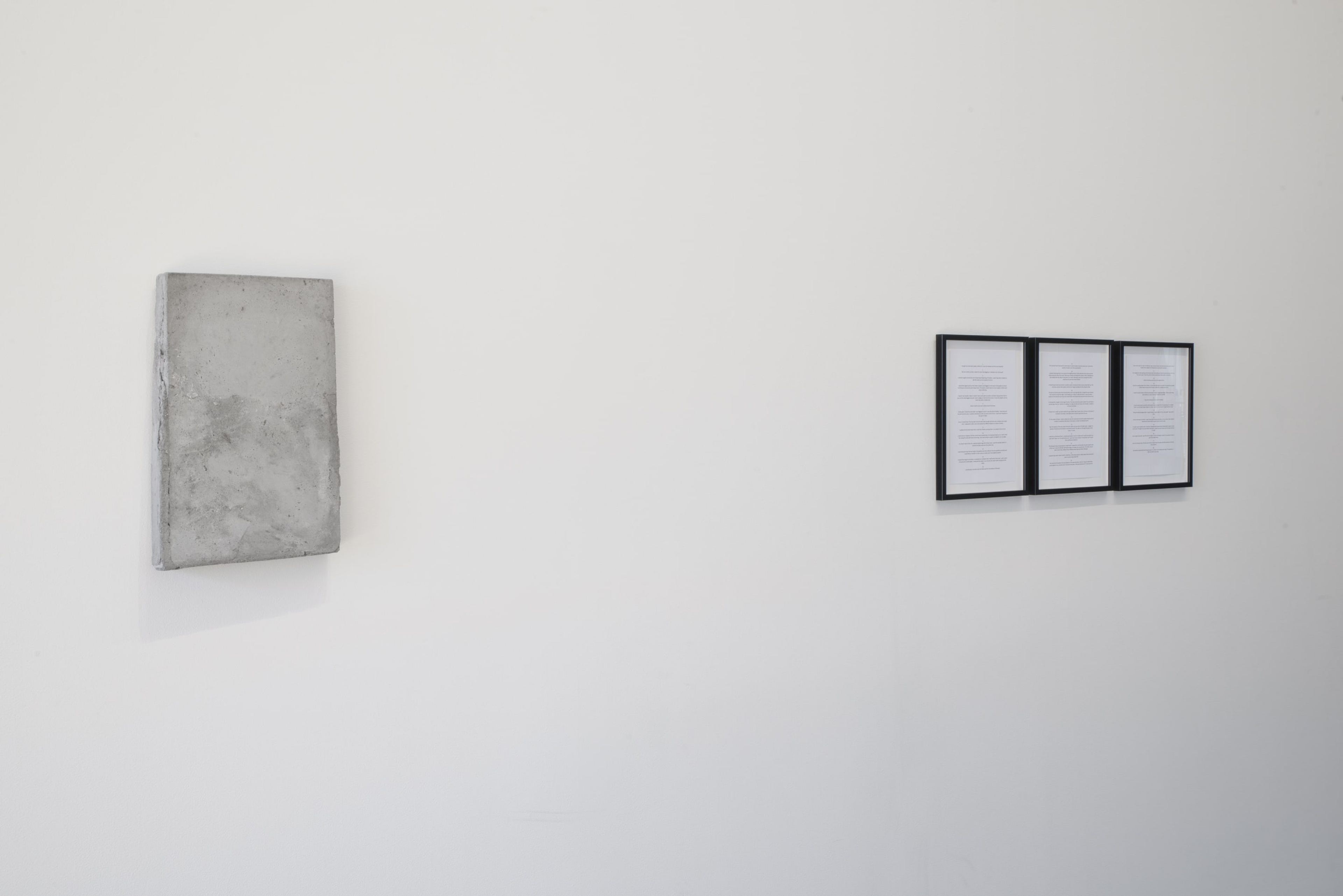 Wendelien Bakker, Moon Deed in Concrete, 2016, concrete, paper; Swimming Pool, 2015, text printed on paper, framed. Courtesy of the artist. On view in the exhibition The Tomorrow People, Adam Art Gallery Te Pātaka Toi, 22 July – 1 October 2017, photo: Shaun Matthews