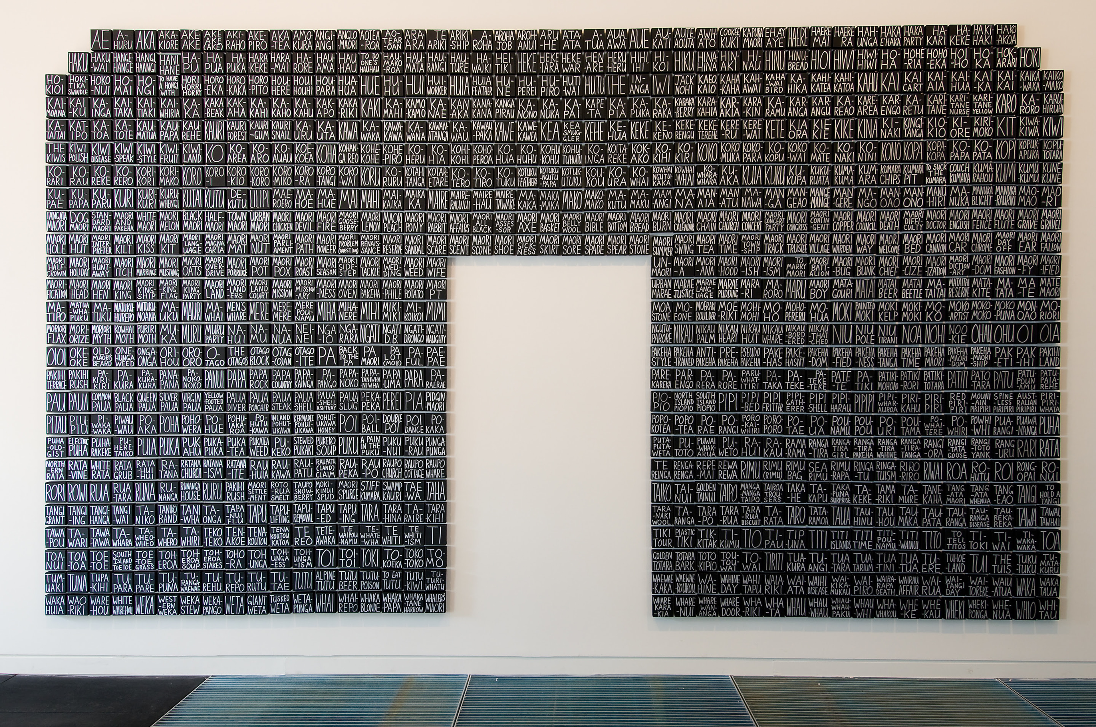 John Reynolds, Looking west, late afternoon, low water, 2007, acrylic on canvas, 2700 x 6500mm, 1,174 100 x 100mm pieces. Installation view, Collect/Project, Adam Art Gallery Te Pātaka Toi, Victoria University of Wellington, 2008. Photo: Robert Cross