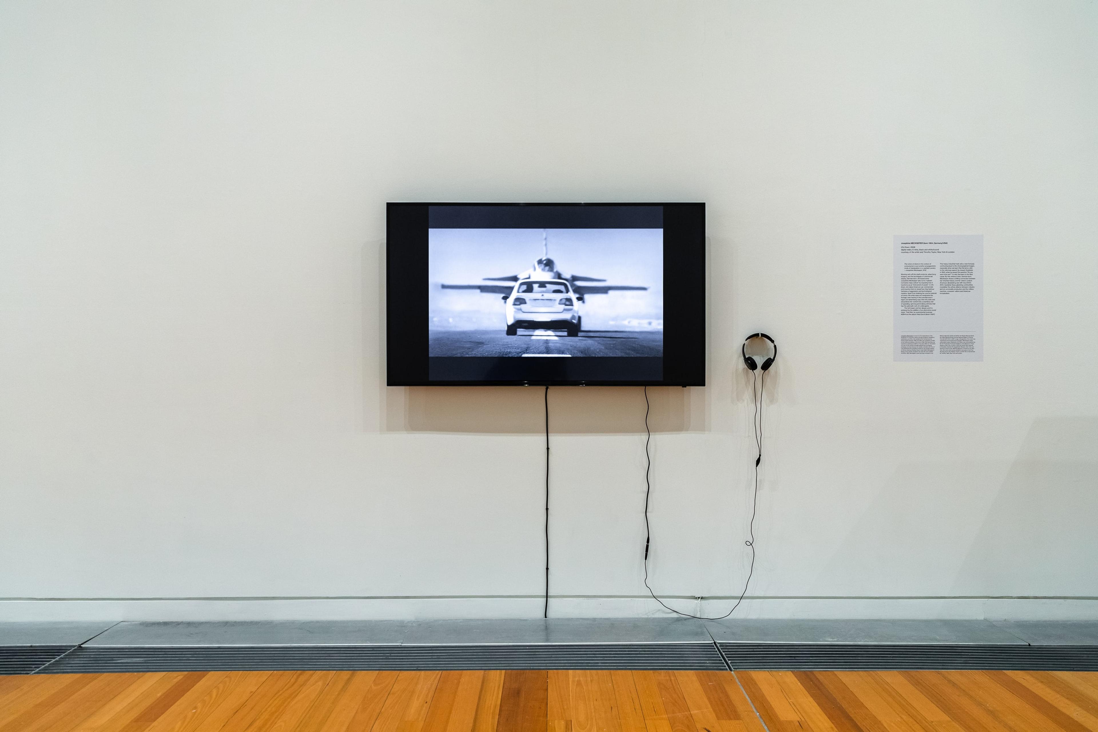 Josephine Meckseper, 0% Down , 2008, digital video, 6 mins, black and white/sound, courtesy of the artist and Timothy Taylor, New York & London. Installation view, Image Processors: Artists in the Medium – A Short History 1968–2020 , Te Pātaka Toi Adam Art Gallery, Victoria University of Wellington, 2021. Photo by Ted Whitaker.