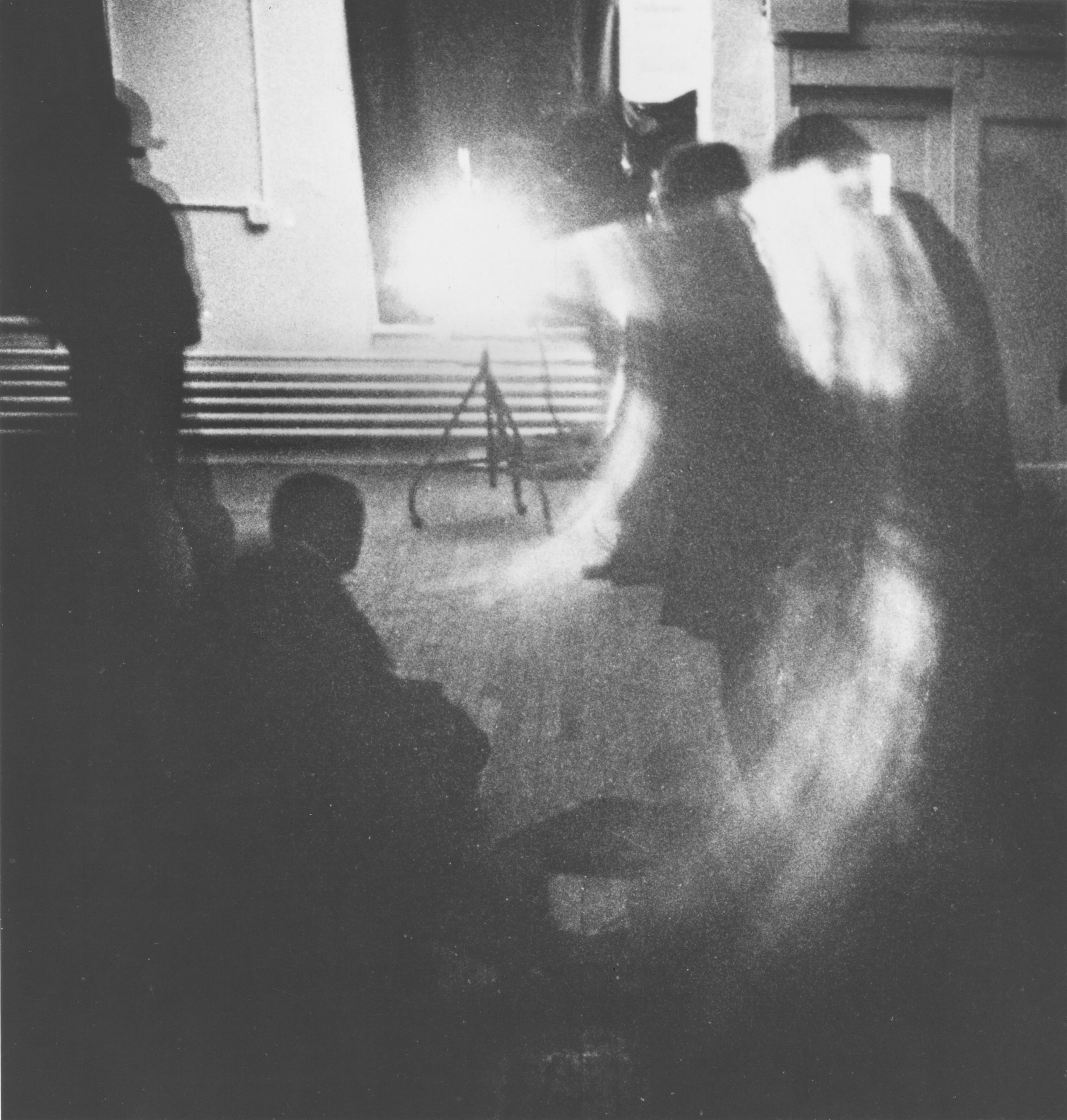 Anthony McCall, Line Describing a Cone, 1973. February 15, 1974. Vintage gelatin silver print, image 159 x 153mm; photograph 248 x 203mm. Photograph of the first showing of the film in the U.S. at Artists Space, New York. Courtesy of the artist and Sean Kelly, New York