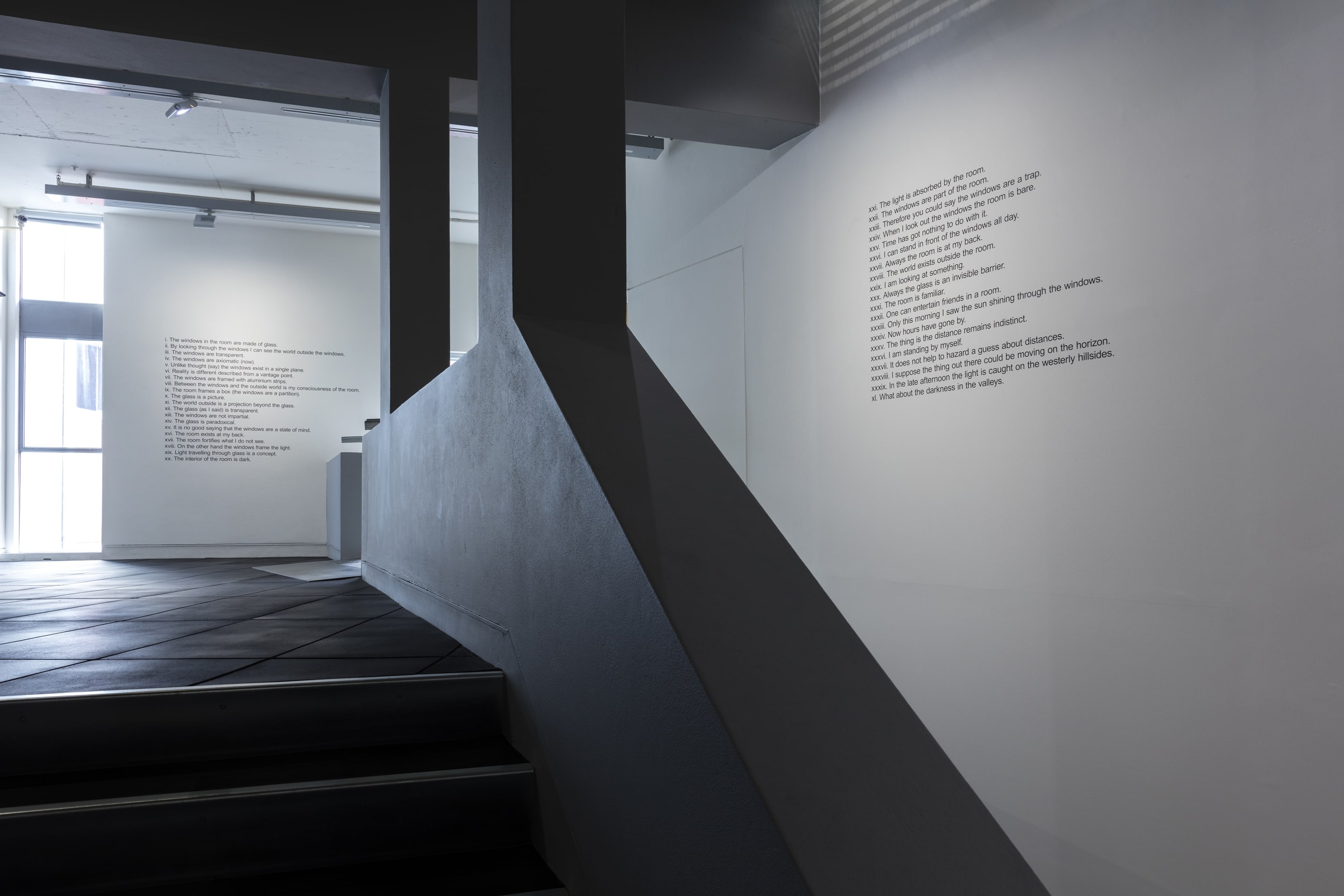 Installation view, Mike Parr, Facts about the Room, 1970/2016, vinyl lettering on wall, collection of Auckland Art Gallery Toi o Tamaki. In the exhibition Inhabiting Space at the Adam Art Gallery Te Pātaka Toi, Victoria University of Wellington (photo: Shaun Waugh)