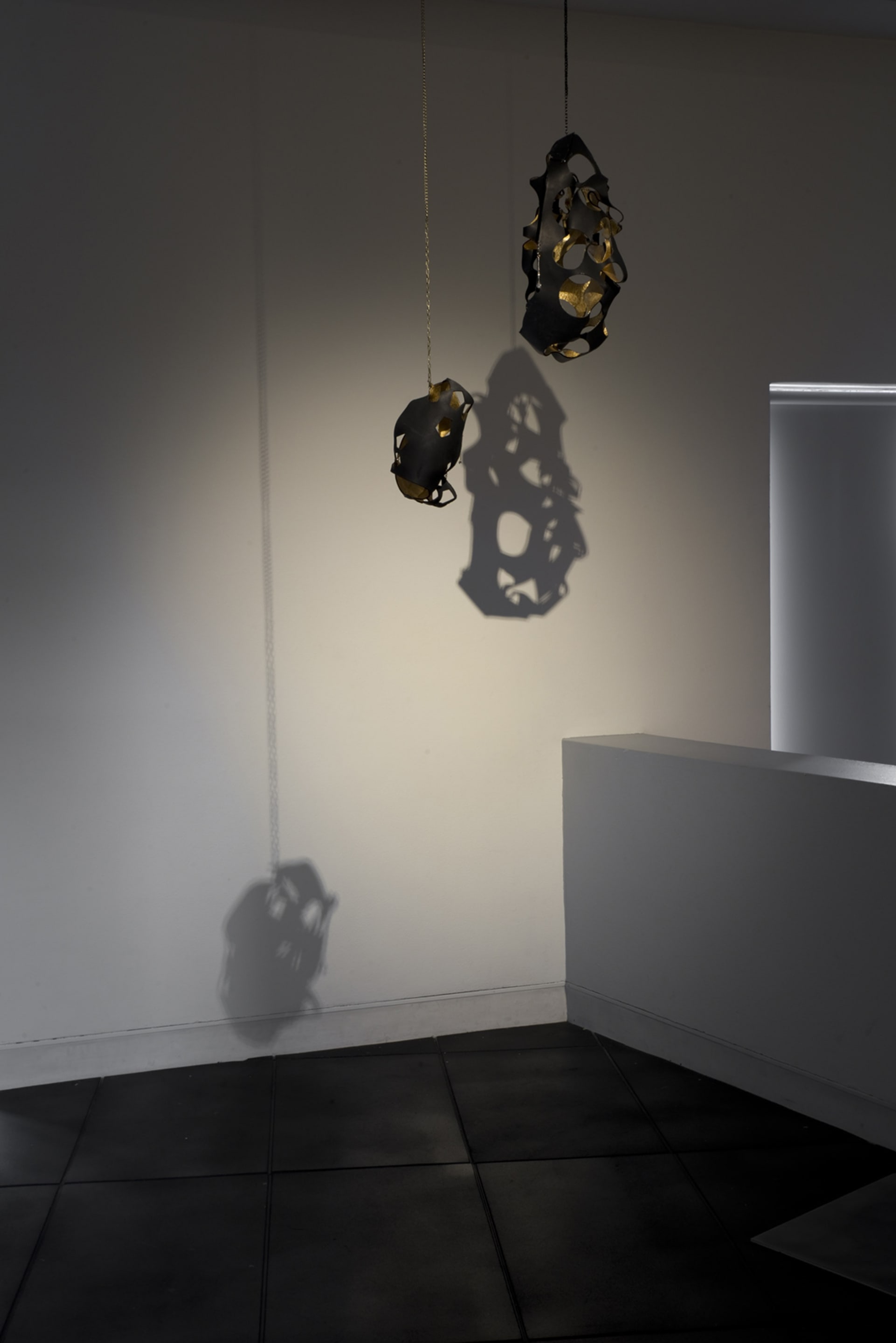 Signe Rose, Bondage Jewel 2016 and Bondage Egg 2015, gold leaf, leather, chain, jewellery findings. Courtesy of the artist, on view in Acting Out at Adam Art Gallery Te Pātaka Toi, photo: Shaun Matthews