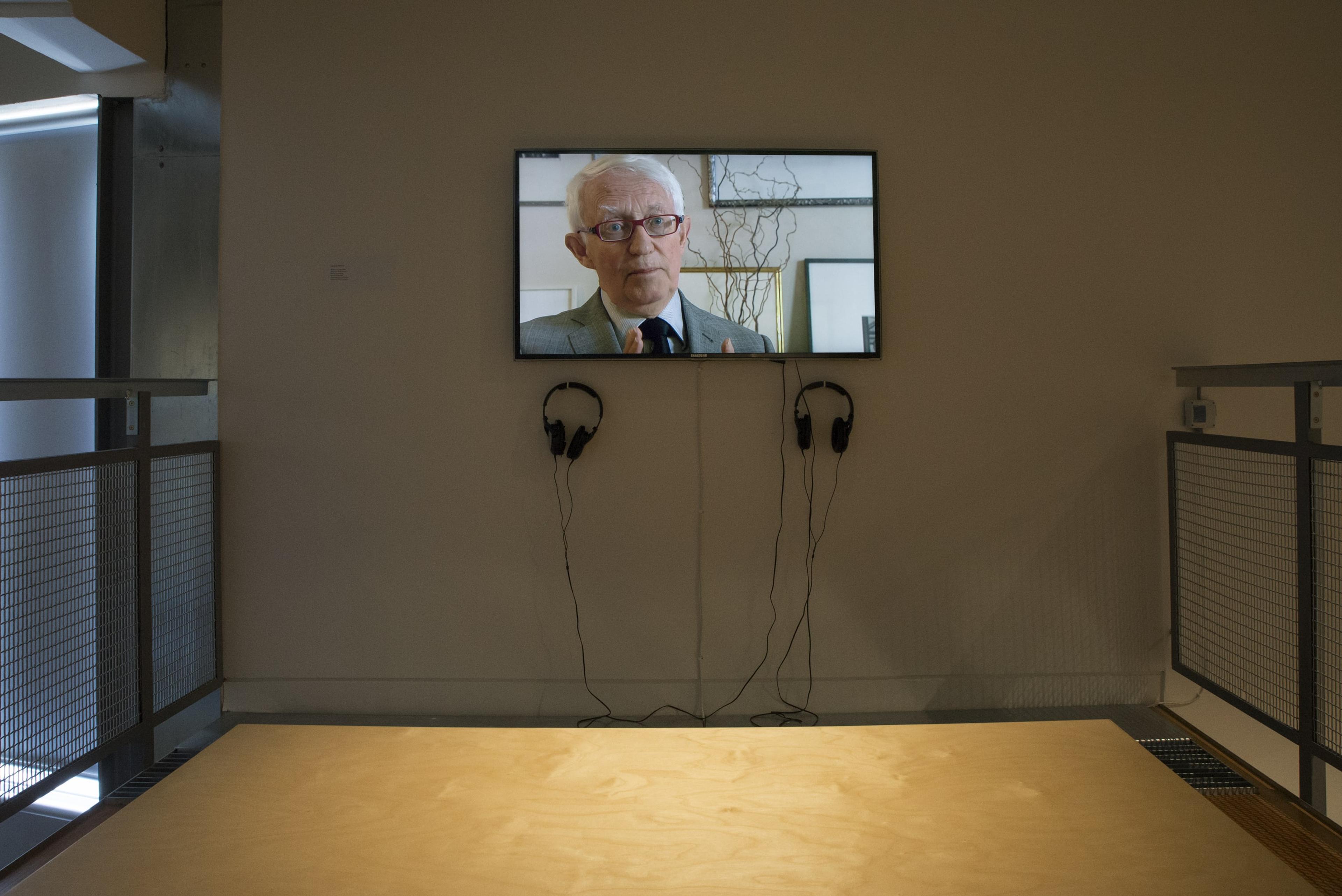 Installation view of The Man in the Hat (2009), digital video, 6mins (excerpts), Director: Luit Bieringa, Producer: Jan Bieringa, Cinematographer: Leon Narbey, Produced by BWX Productions.