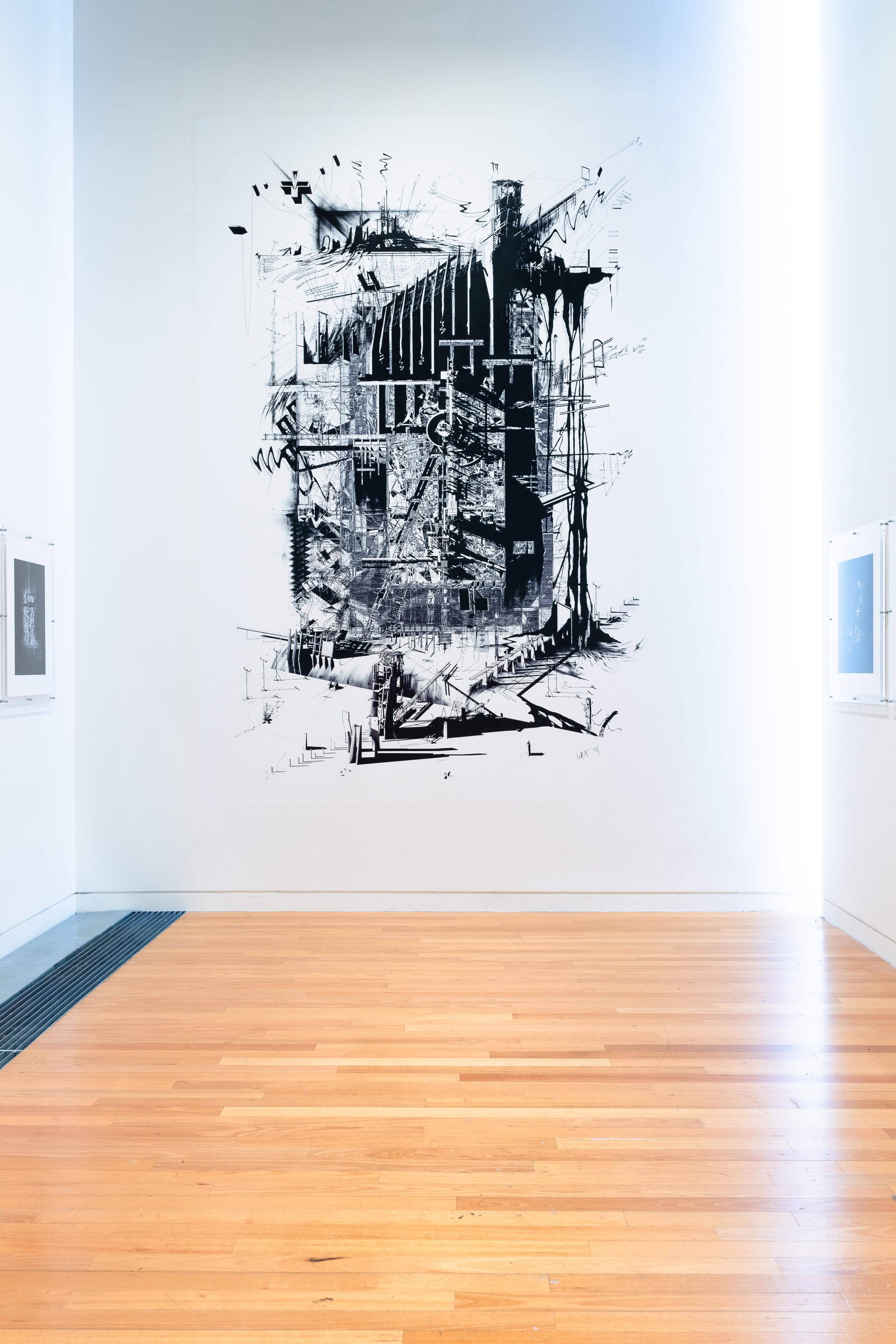 A gallery with white walls and wooden floors. A largescale print on the wall of a greyscale architectural drawing, with light from a window shining down the right side.