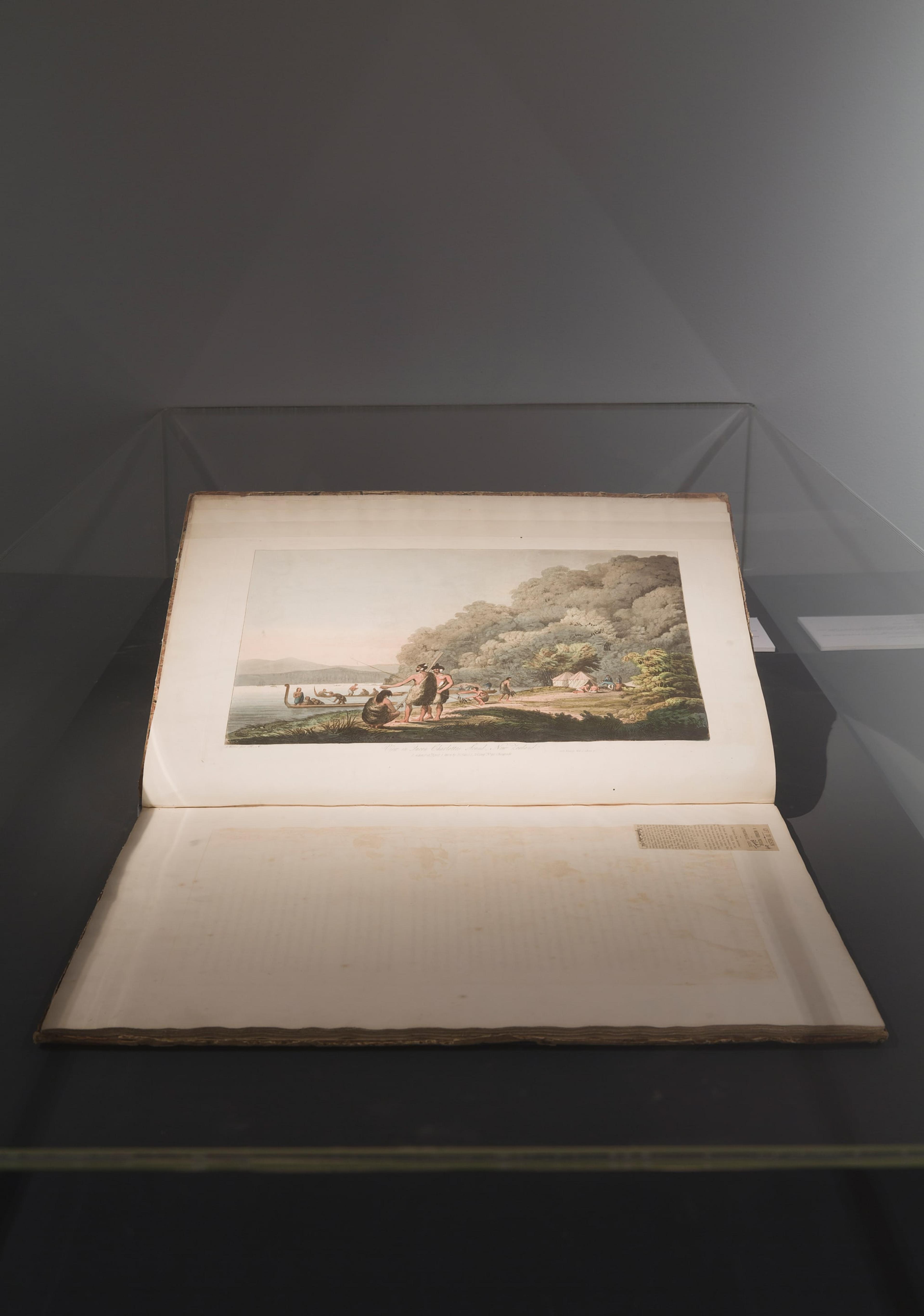 Installation view of State of the art at the Adam Art Gallery, showing John Webber (1751-1793), View in Queen Charlotte’s Sound, New Zealand, ca. 1820. Hand-coloured etching and aquatint from Views in the South Seas / from drawings by James [i.e. John] Webber, London: Boydell, 1808 [i.e. ca. 1820], 292 x 414mm. Wellington: Victoria University of Wellington Library. Photo: Shaun Waugh