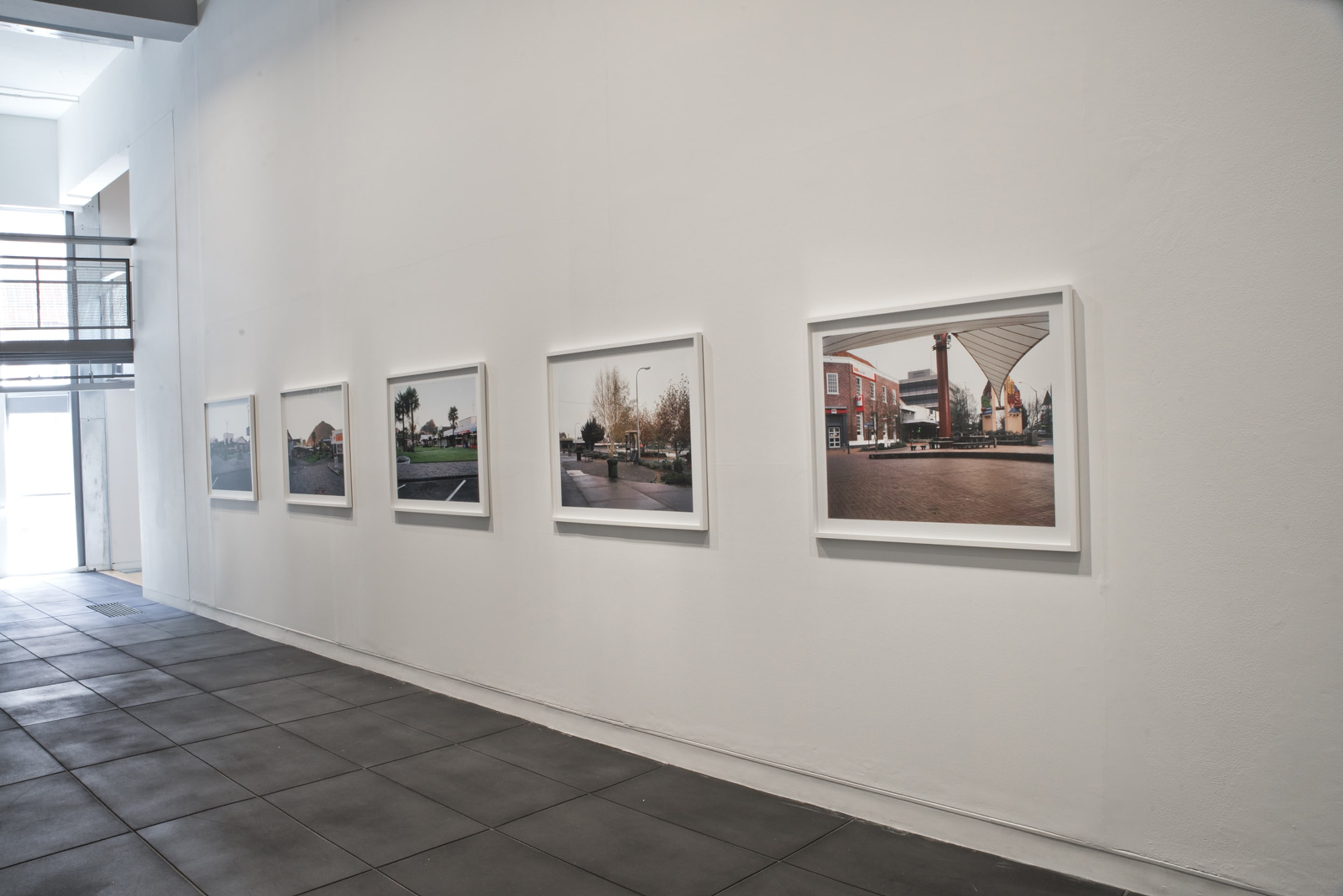 Fiona Amundsen, Jellicoe Court (facing East), Kawerau, 22/04/2007, 7.05 (glowing lamp), Jellicoe Court (facing North), Kawerau, 06/05/2007, 7.13 (autumn light), Jellicoe Court, Kawerau, 06/05/2007, 6.57 (star burst), Civic Square, Murupara, 02/06/2007, 7.21 (bird and lamp-post), City Focus, Rotorua, 24/06/2007 (waiting birds), 2007, chromira digital photographs, Victoria University of Wellington Art Collection, commissioned 2007. On view in the exhibition Out of Site – Works from the Victoria University of Wellington Art Collection, at Adam Art Gallery Te Pātaka Toi Victoria University of Wellington, 18 February – 23 April 2017, Photo: Shaun Matthews