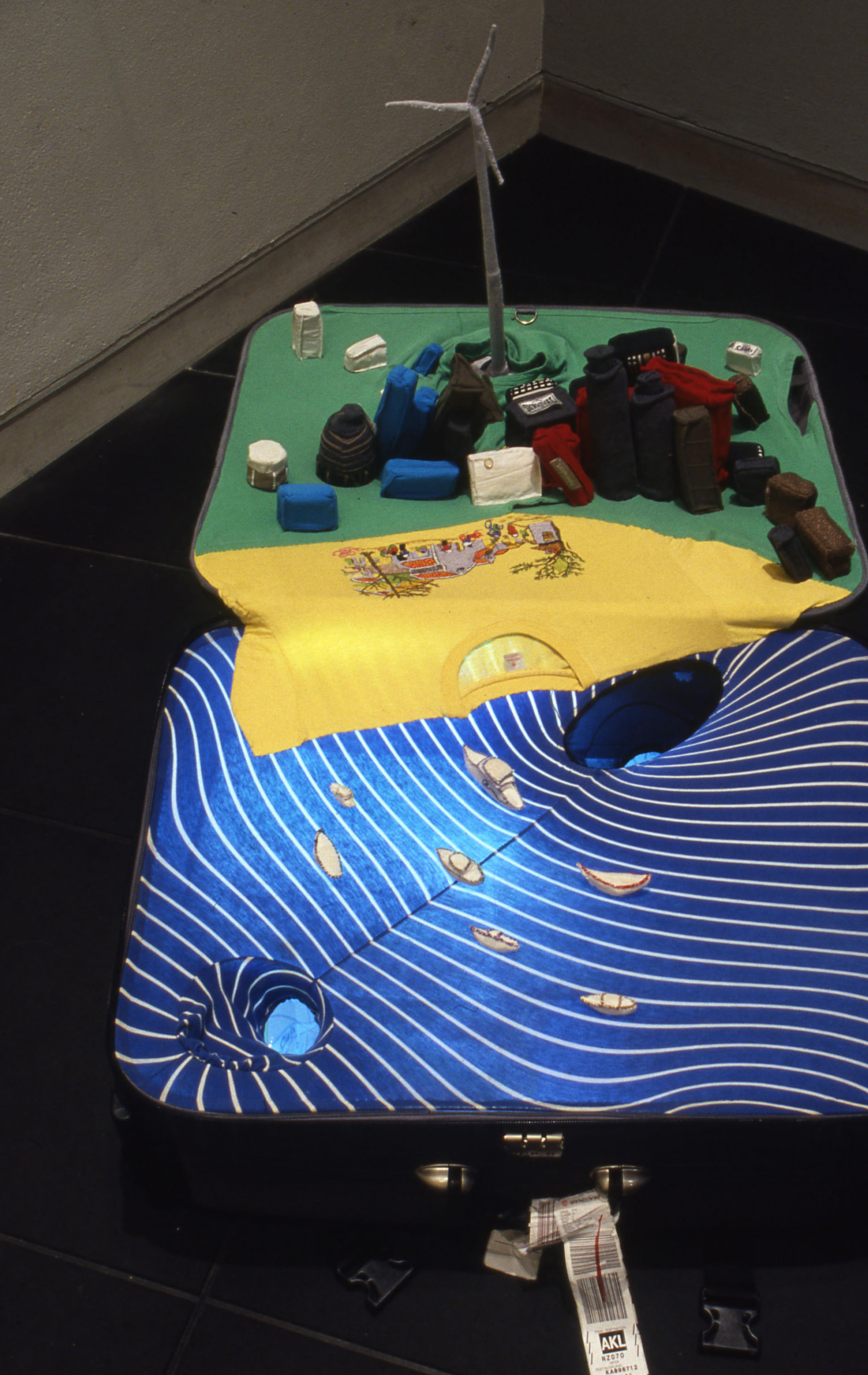 Yin Xiuzhen, Portable Cities, 2001, suitcases, textiles, sampled sound. Installation view, Concrete Horizons: Contemporary Art from China, Adam Art Gallery Te Pātaka Toi, Victoria University of Wellington, 2004