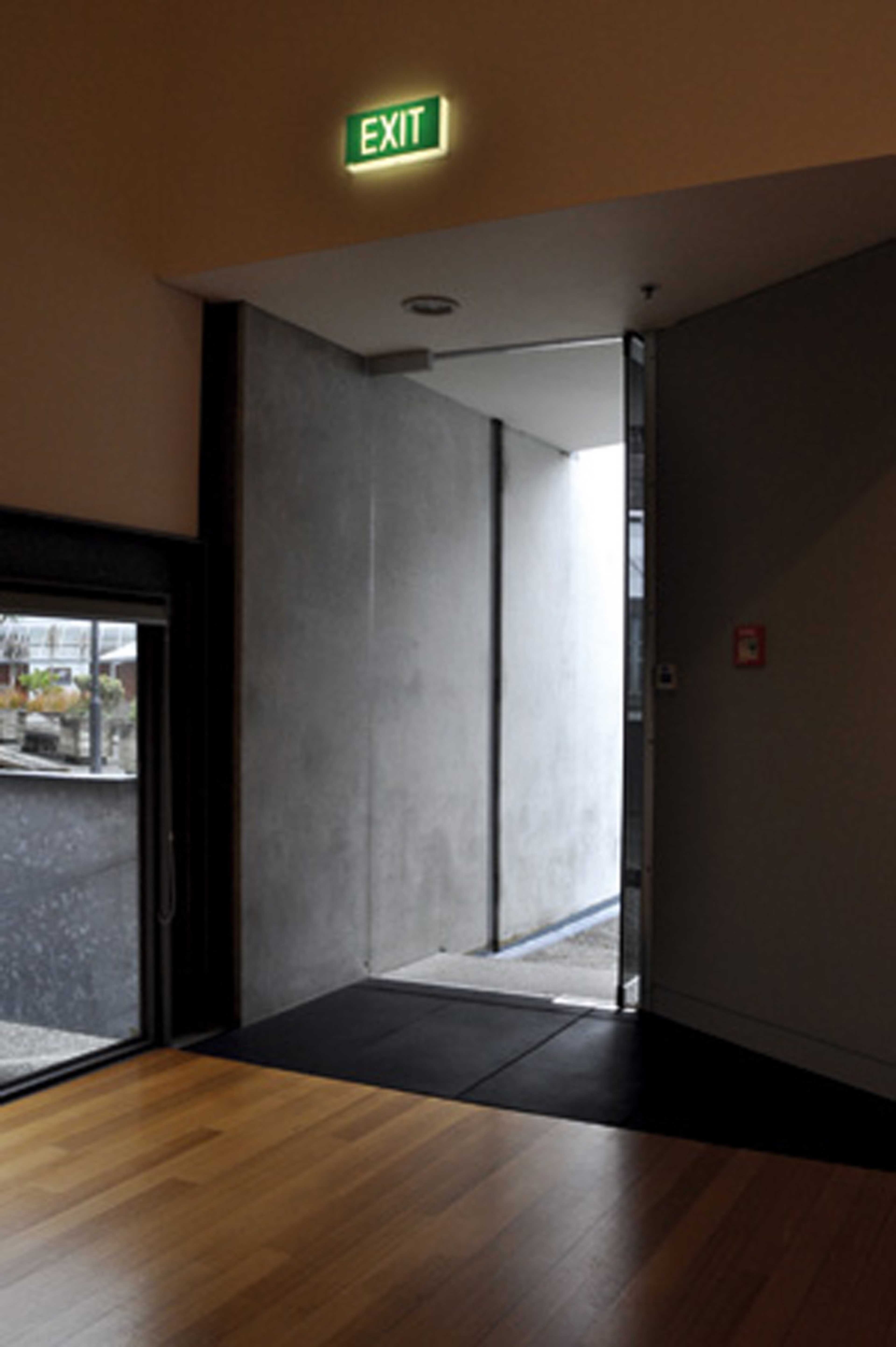 Martyn Reynolds, Unthought things becoming thoughts, 2009, 11 actors, projected statements, open door. Installation view, The Future is Unwritten, Adam Art Gallery Te Pātaka Toi, Victoria University of Wellington, 2009