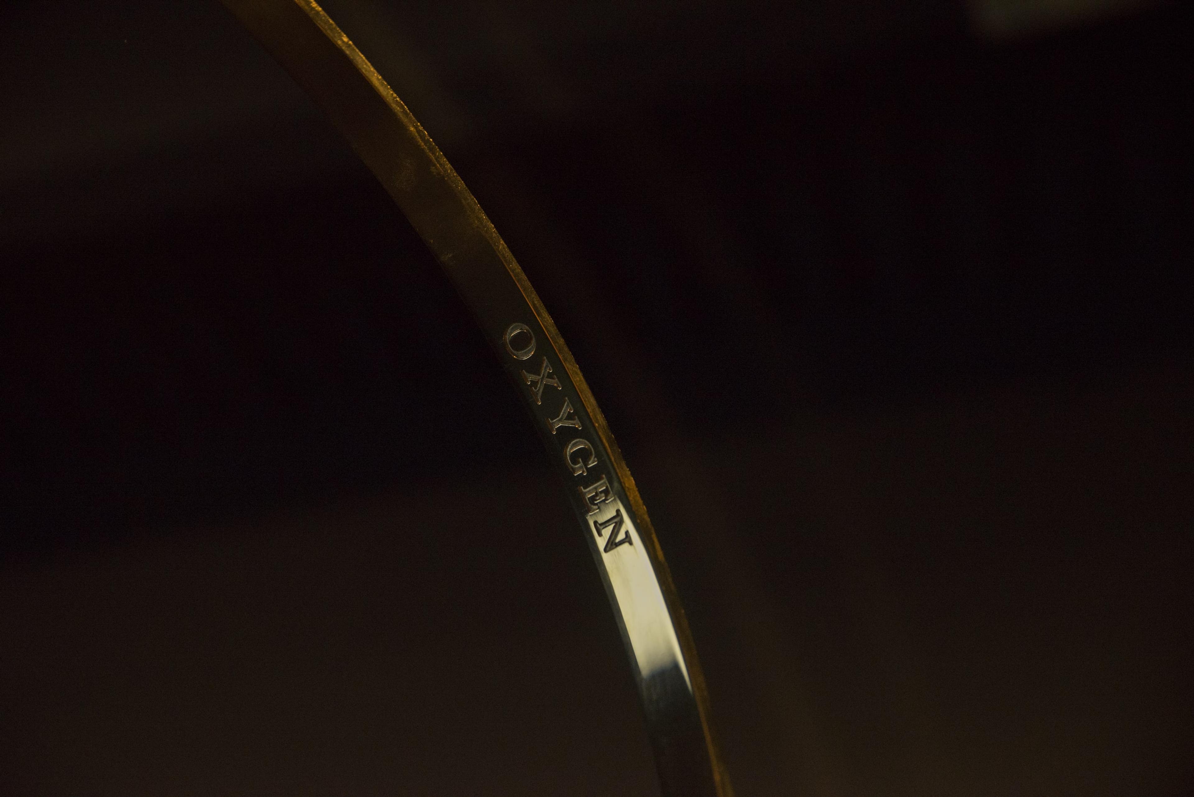 Installation view of Dane Mitchell, Structural Formula, Water Molecule, 2015, brass, Victoria University of Wellington Art Collection, purchased 2018, in the exhibition Solid State: Works from the Victoria University of Wellington Art Collection, 6 October – 20 December 2018, Adam Art Gallery Te Pātaka Toi.