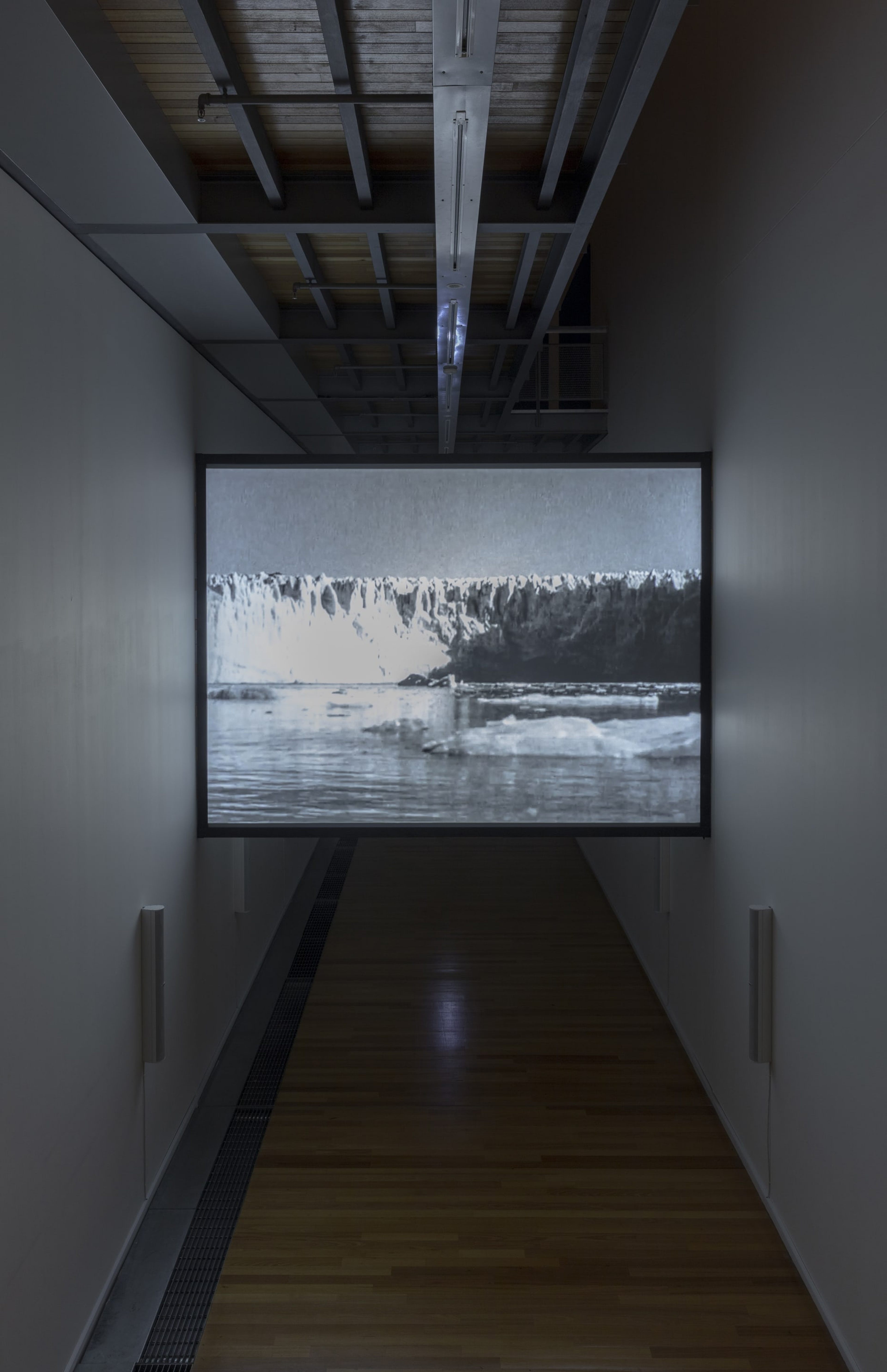 Susan Philipsz, White Flood, 2019, 12-channel sound installation and HD film, 15 minutes. Courtesy of the artist, Tanya Bonakdar Gallery, New York and Galerie Isabella Bortolozzi, Berlin. Installation view, Passages: Luke Fowler, Florian Hecker, Susan Philipsz, curated by Stephen Cleland, Adam Art Gallery Te Pātaka Toi, Victoria University of Wellington, 2019. Photo: Shaun Waugh.