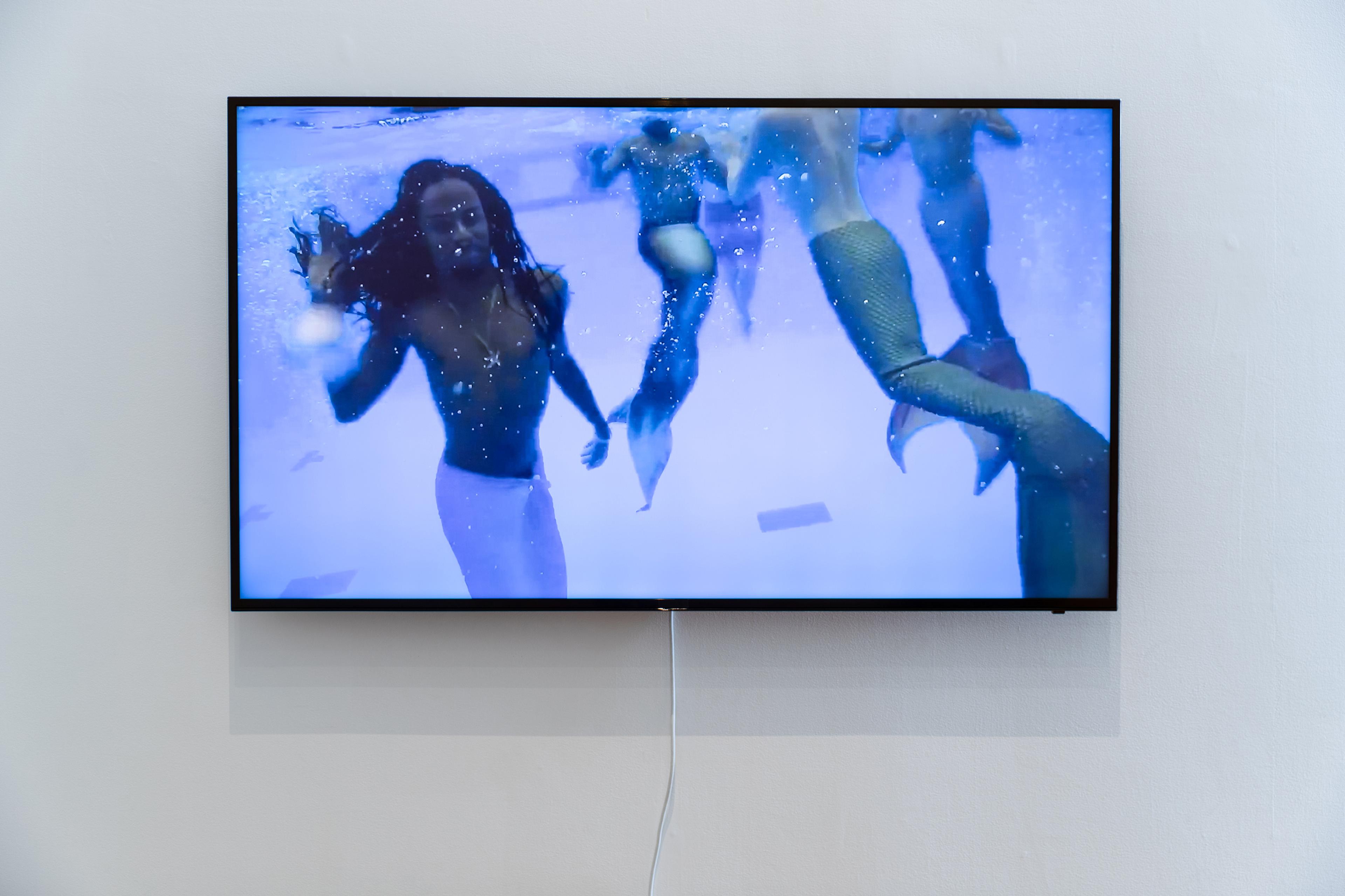 Video still from Suzanne Husky, On the Proliferation of Mermaids in the Time of Shipwrecks, 2017, video, colour, sound, 25 mins 35 secs. Courtesy of the artist and Galerie Alain Gutharc Gallery, Paris. Installation view, Megan Dunn: The Mermaid Chronicles, Te Pātaka Toi Adam Art Gallery, Te Herenga Waka Victoria University of Wellington, 2022. Photo: Ted Whitaker