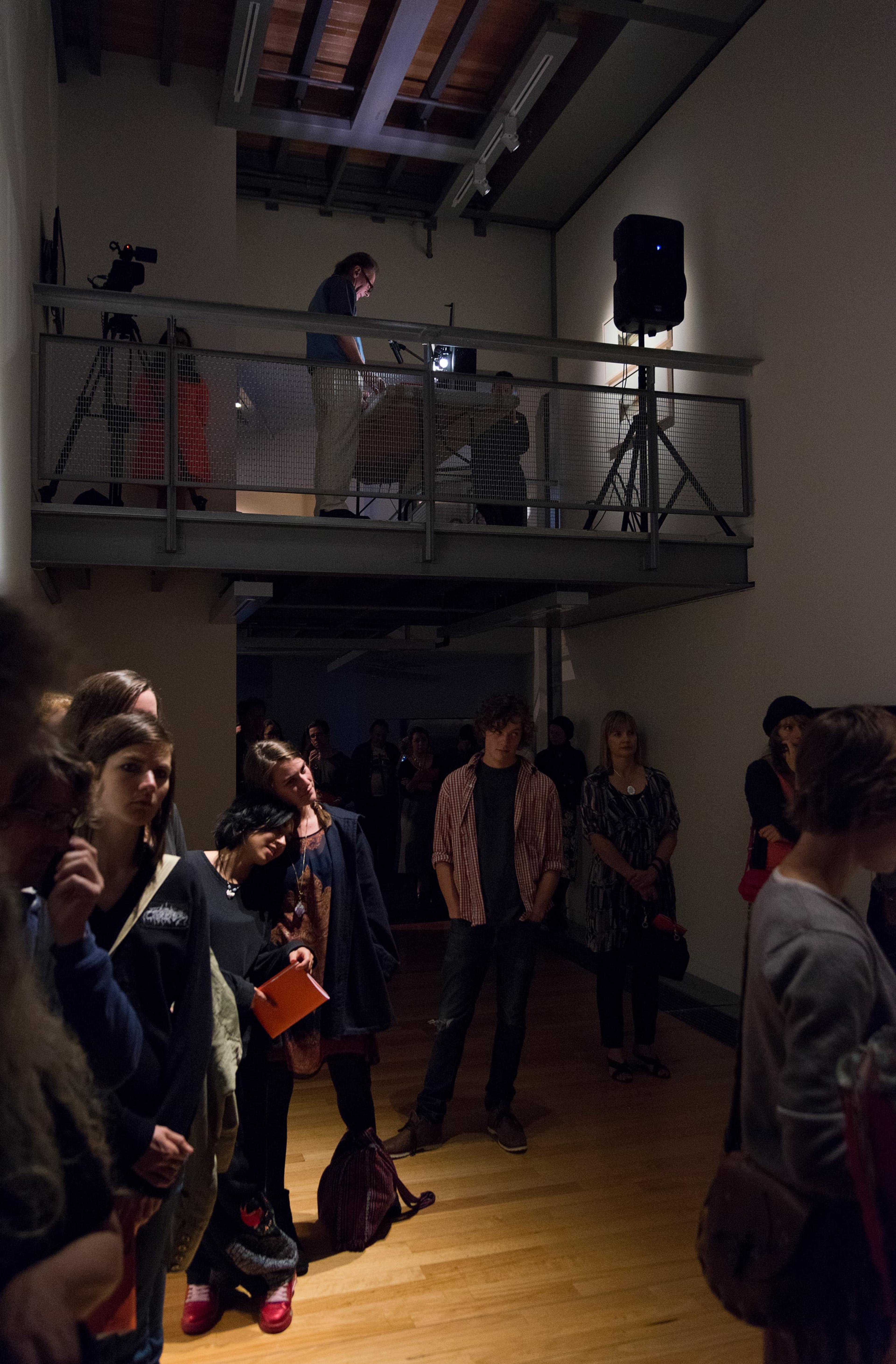 Hollis Frampton, A LECTURE, October 30, 1968, performed on February 11, 2014 by Martin Rumsby at the Adam Art Gallery. Script, 16mm projector, red filter, pipe cleaner. Courtesy of the Estate of Hollis Frampton. Photo: Shaun Waugh
