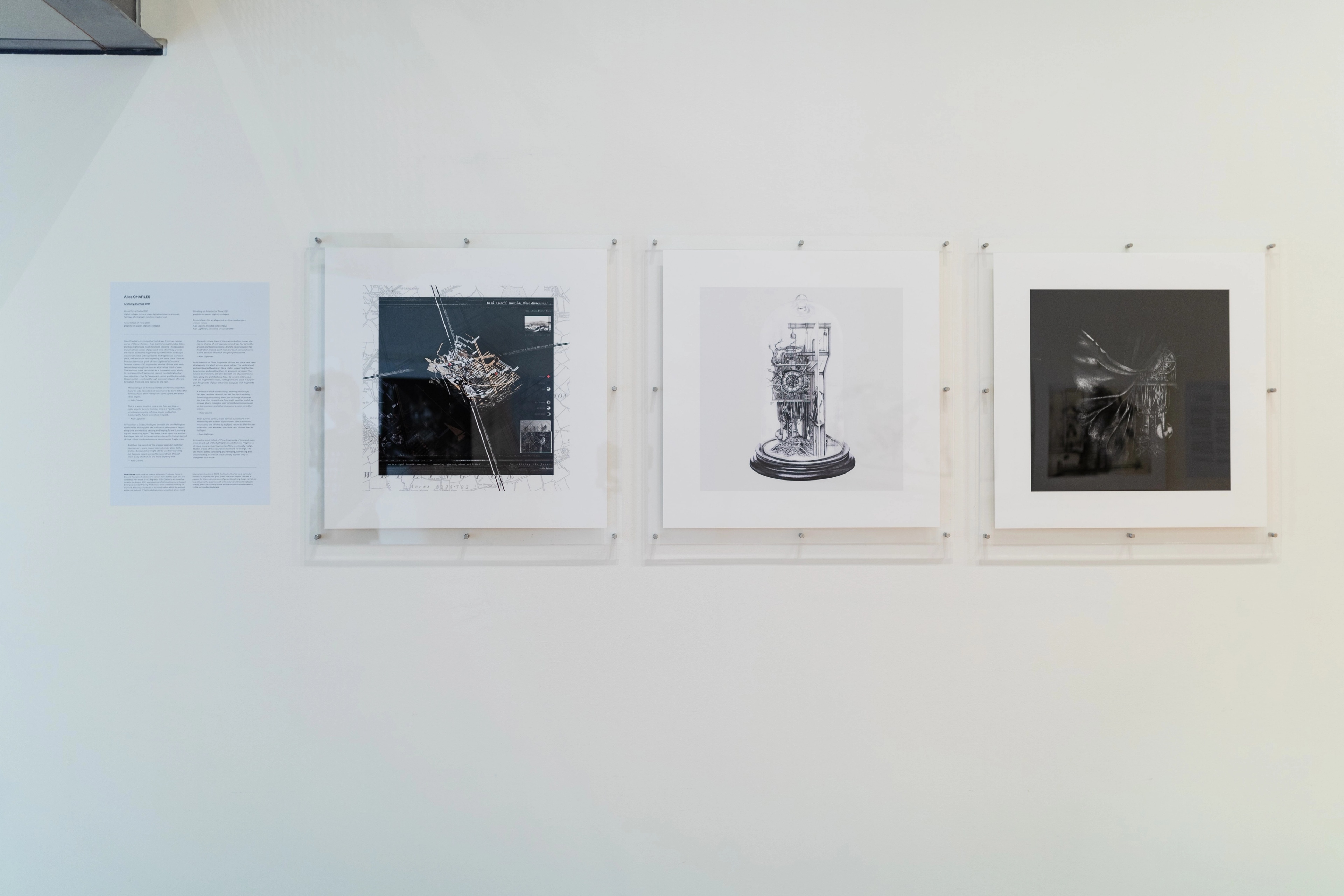Straight on view of a gallery wall with text and square architectural images in perspex mounts. Daniel K. Brown 