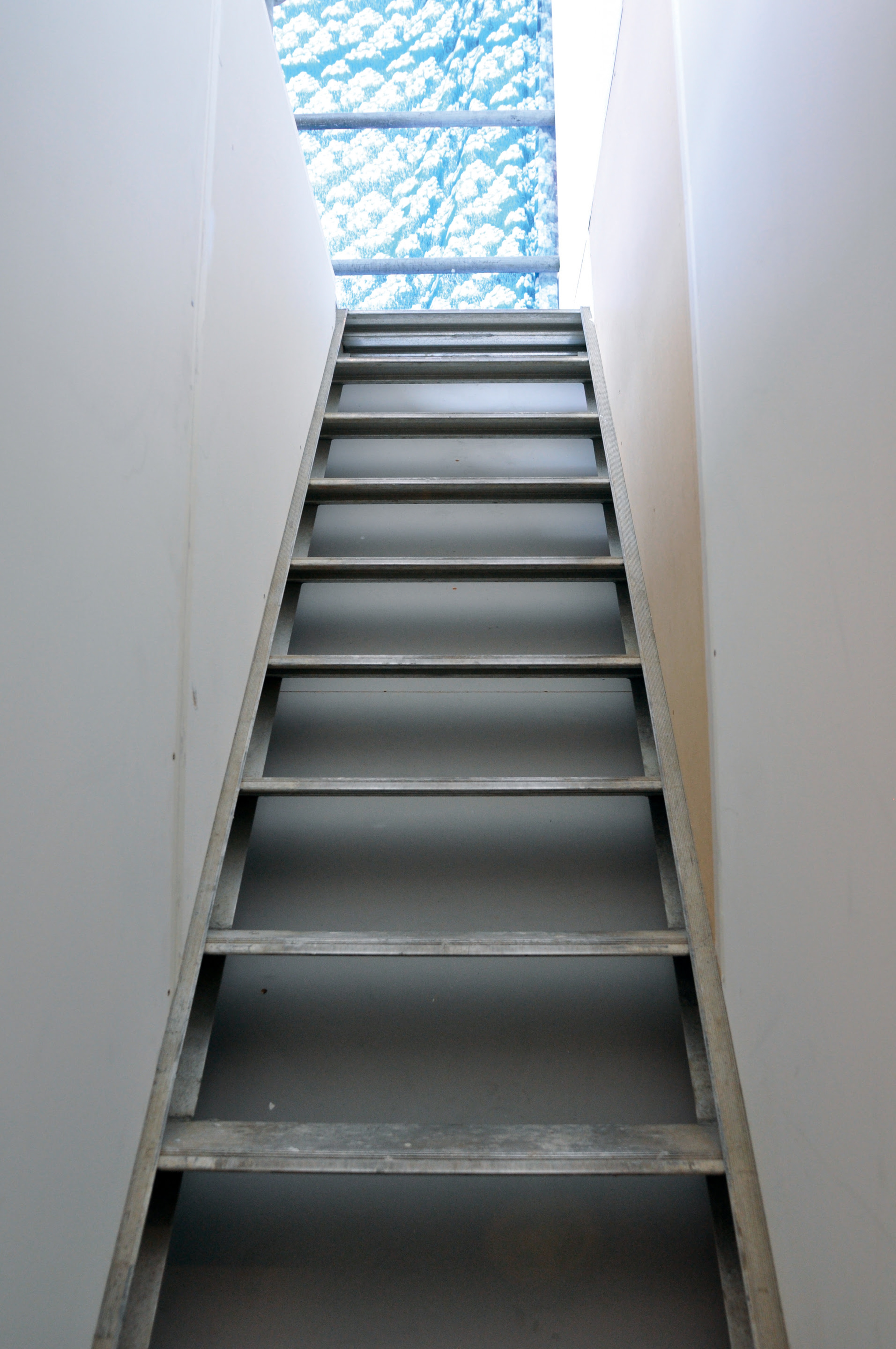 Kate Newby, Falling over with surprise, 2009, carpet, sheets, oil, coffee stains, red wine, lip balm, wood, scaffolding, paint, ceramics. Installation view, The Future is Unwritten, Adam Art Gallery Te Pātaka Toi, Victoria University of Wellington, 2009