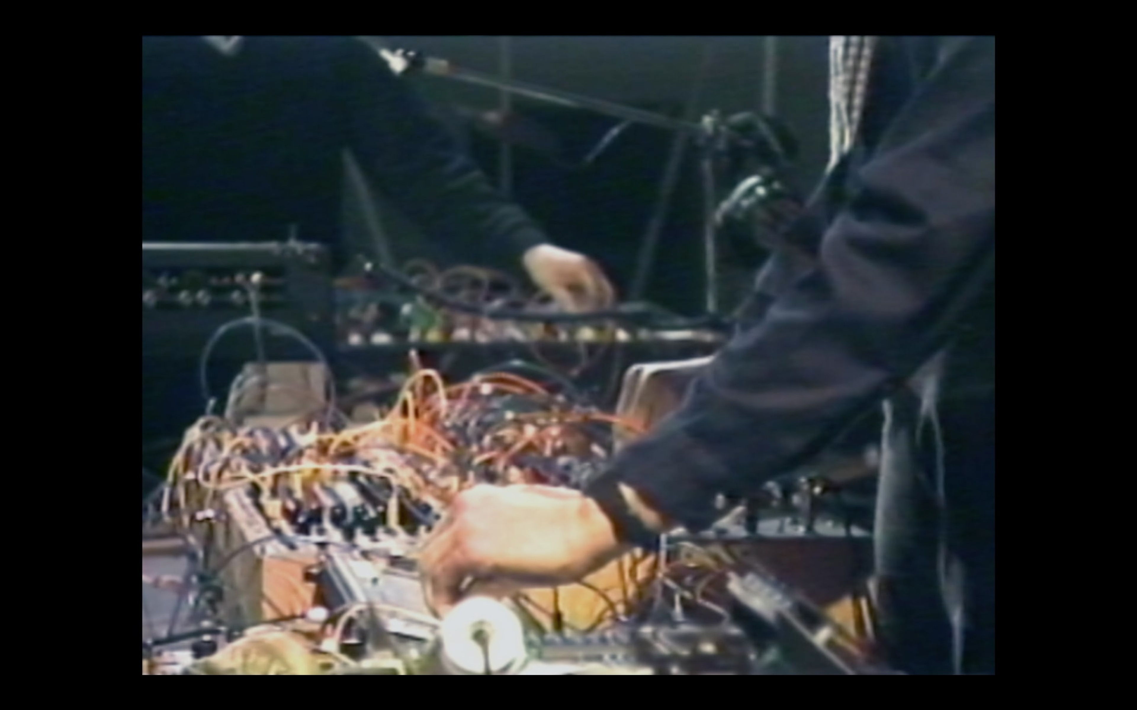 Luke Fowler, Electro-Pythagoras (A Portrait of Martin Bartlett) (video still), 2017, 16mm film transferred to HD video, 45 Minutes, colour, stereo, 4:3. Courtesy of the artist, The Modern Institute, Glasgow and Gisela Capitain Gallery, Cologne. Installation view, Passages: Luke Fowler, Florian Hecker, Susan Philipsz, curated by Stephen Cleland, Adam Art Gallery Te Pātaka Toi, Victoria University of Wellington, 2019. Photo: Shaun Waugh.