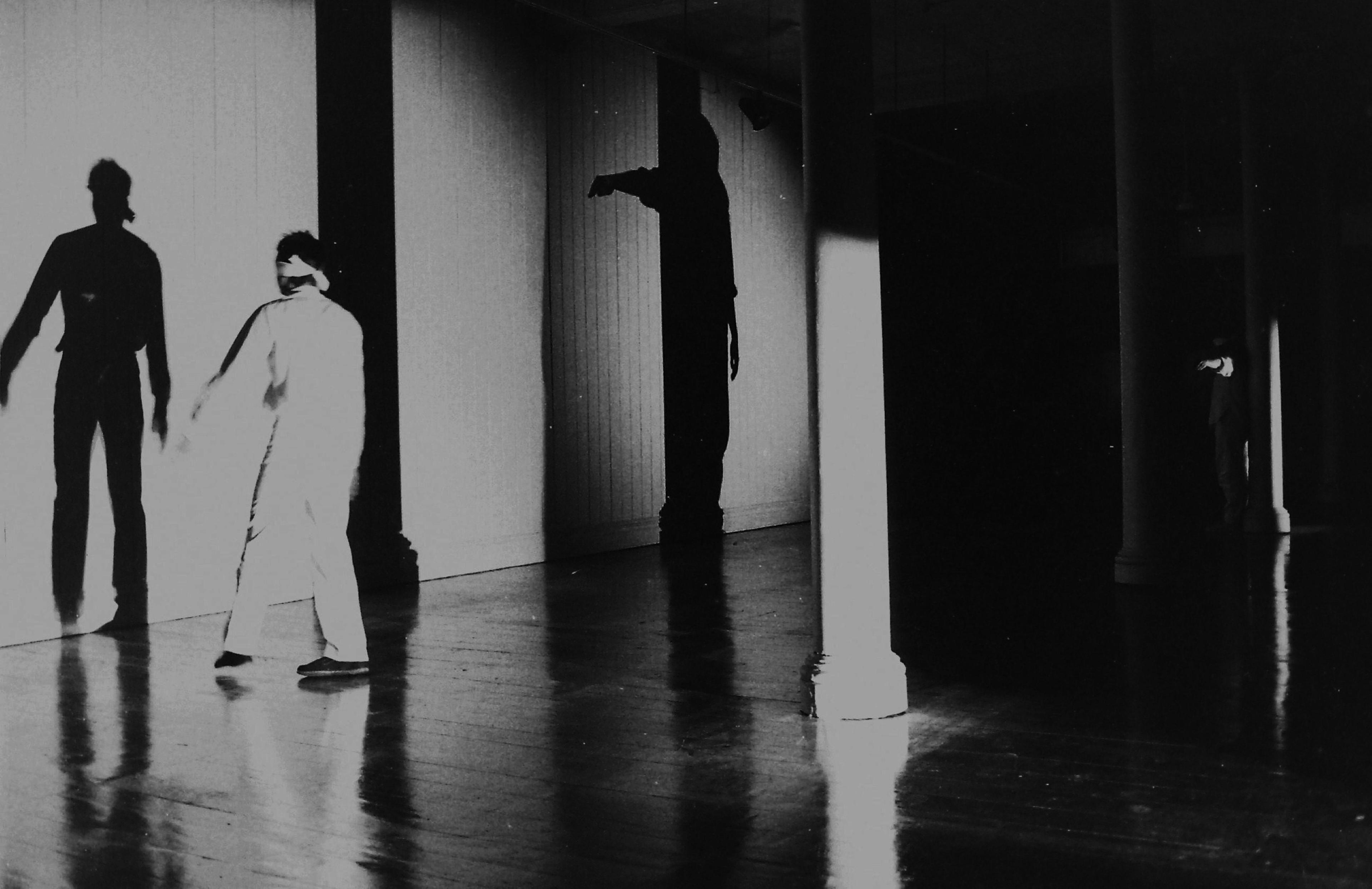 Black and white photo of blindfolded performer