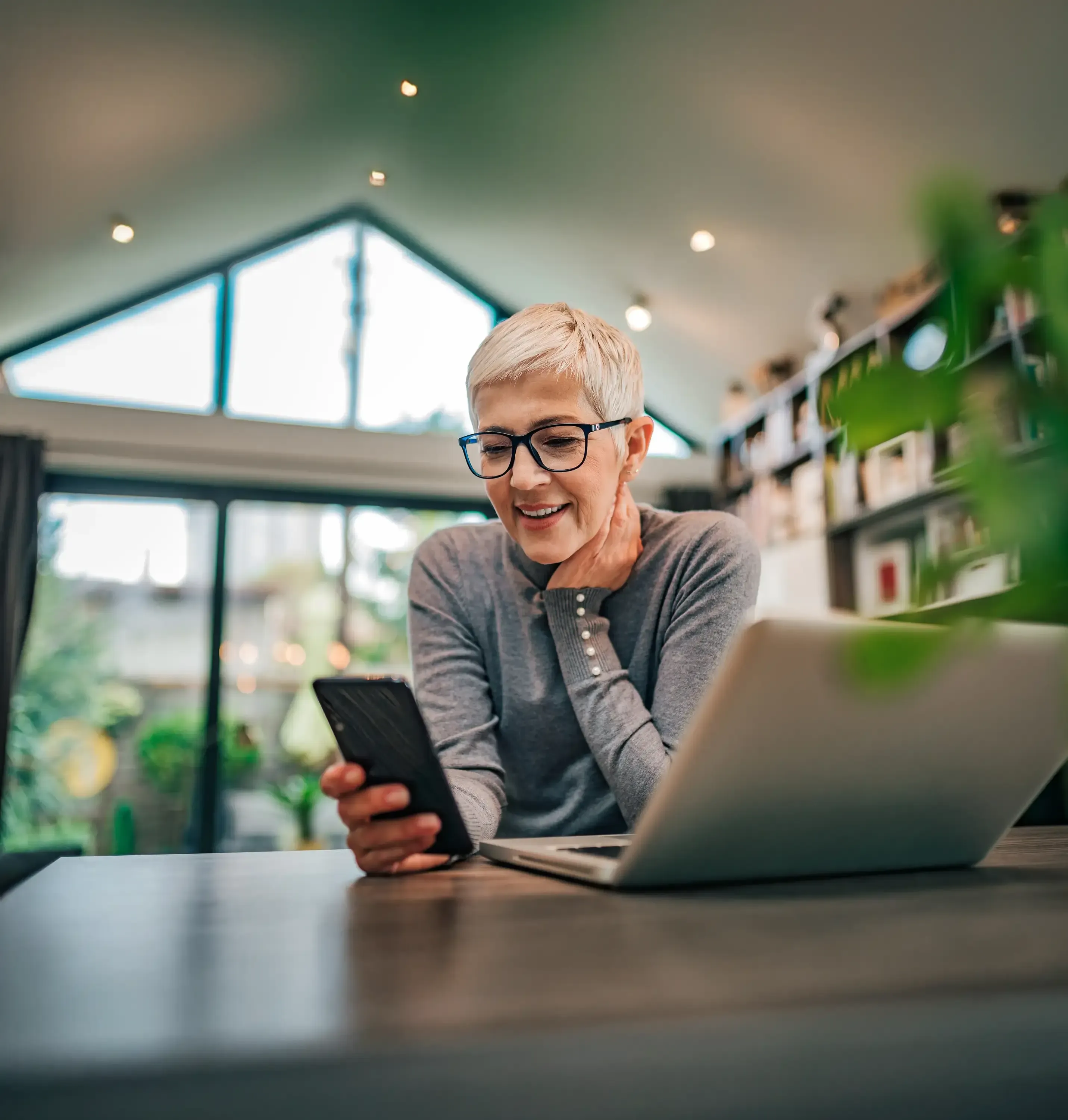 Woman-on-devices-happy